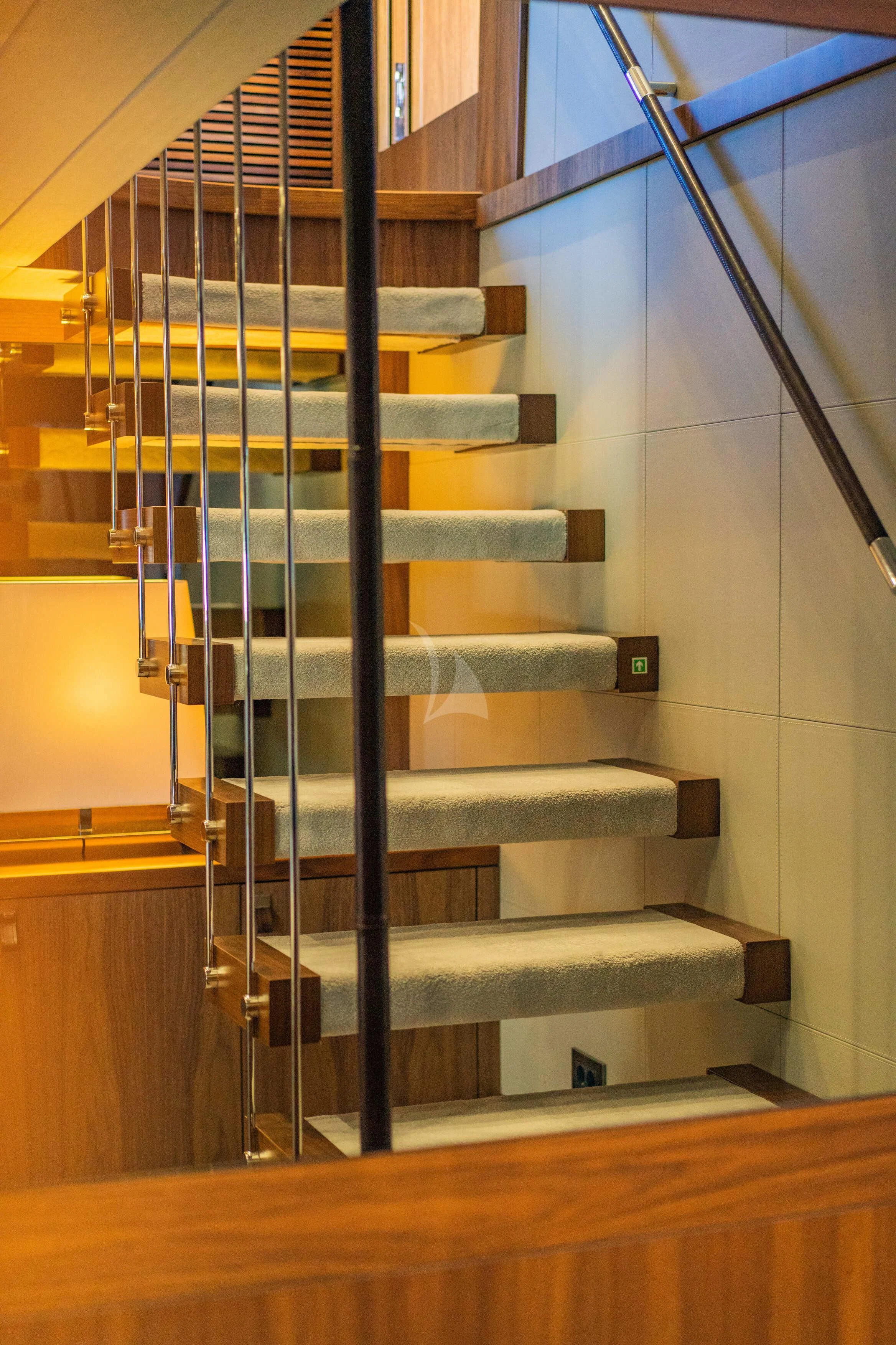 a staircase with a metal railing aboard BLACK MAMBA Yacht for Charter