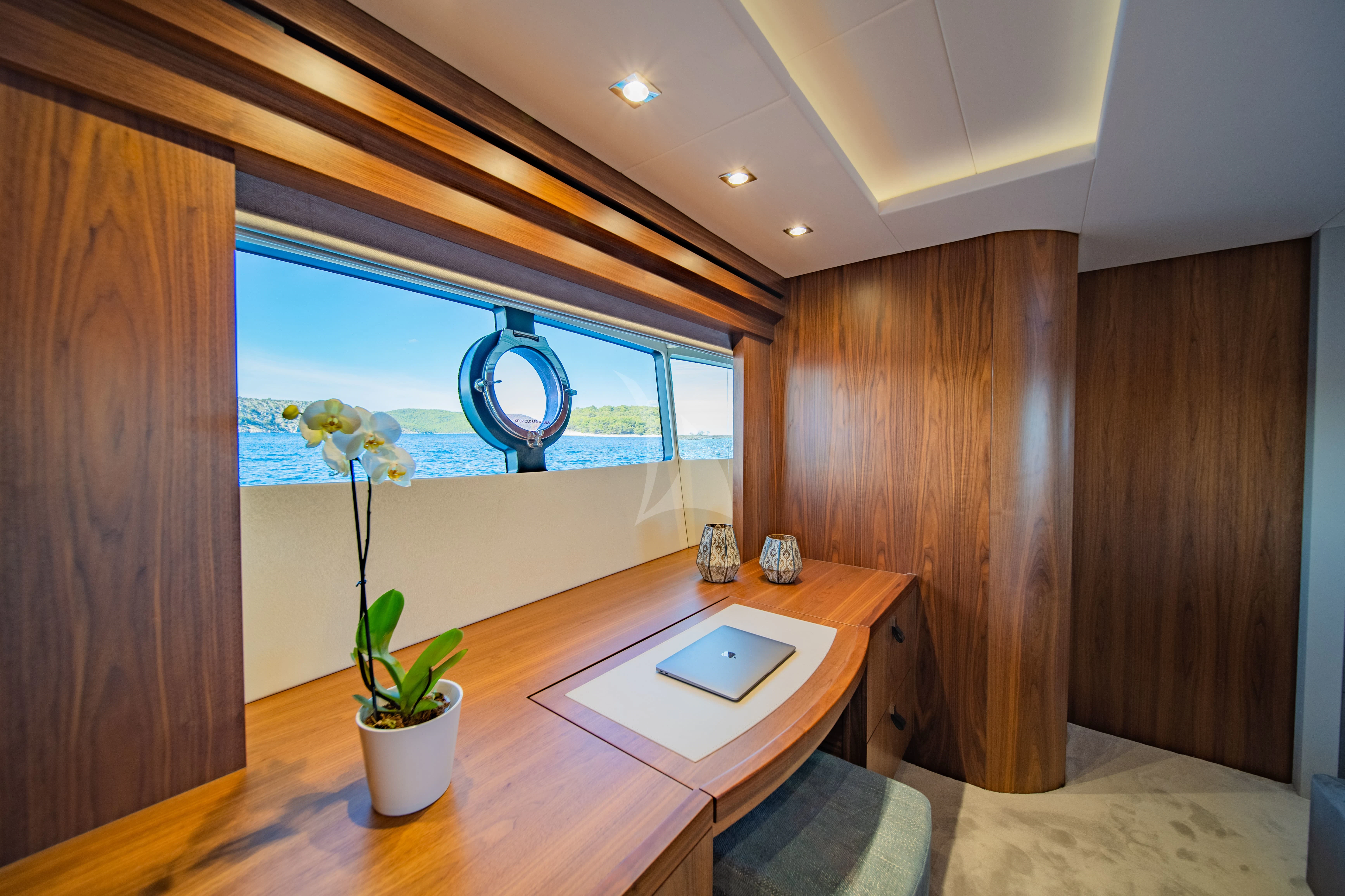 a room with a table and a window aboard BLACK MAMBA Yacht for Charter