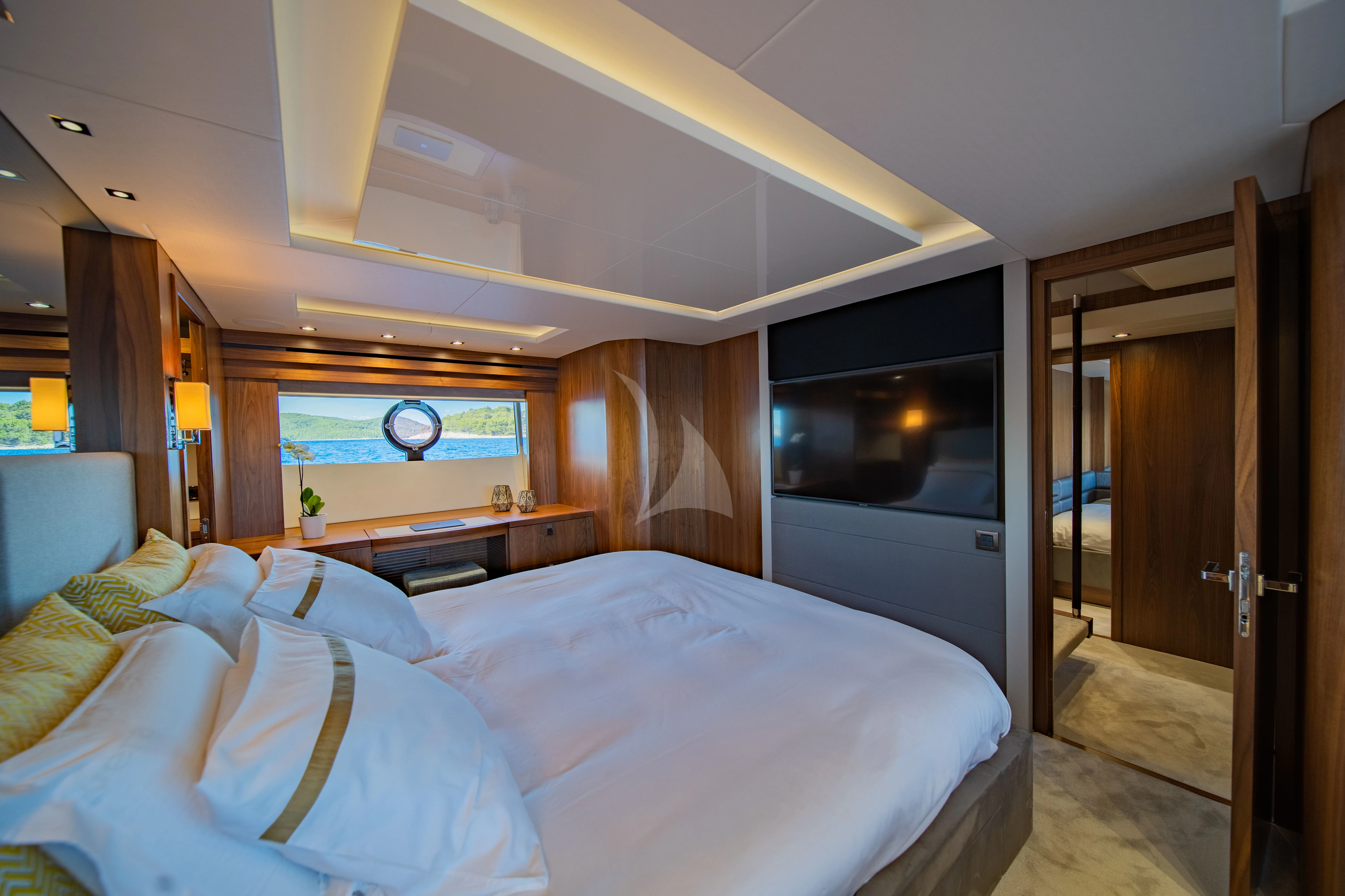 a bedroom with a large bed aboard BLACK MAMBA Yacht for Charter