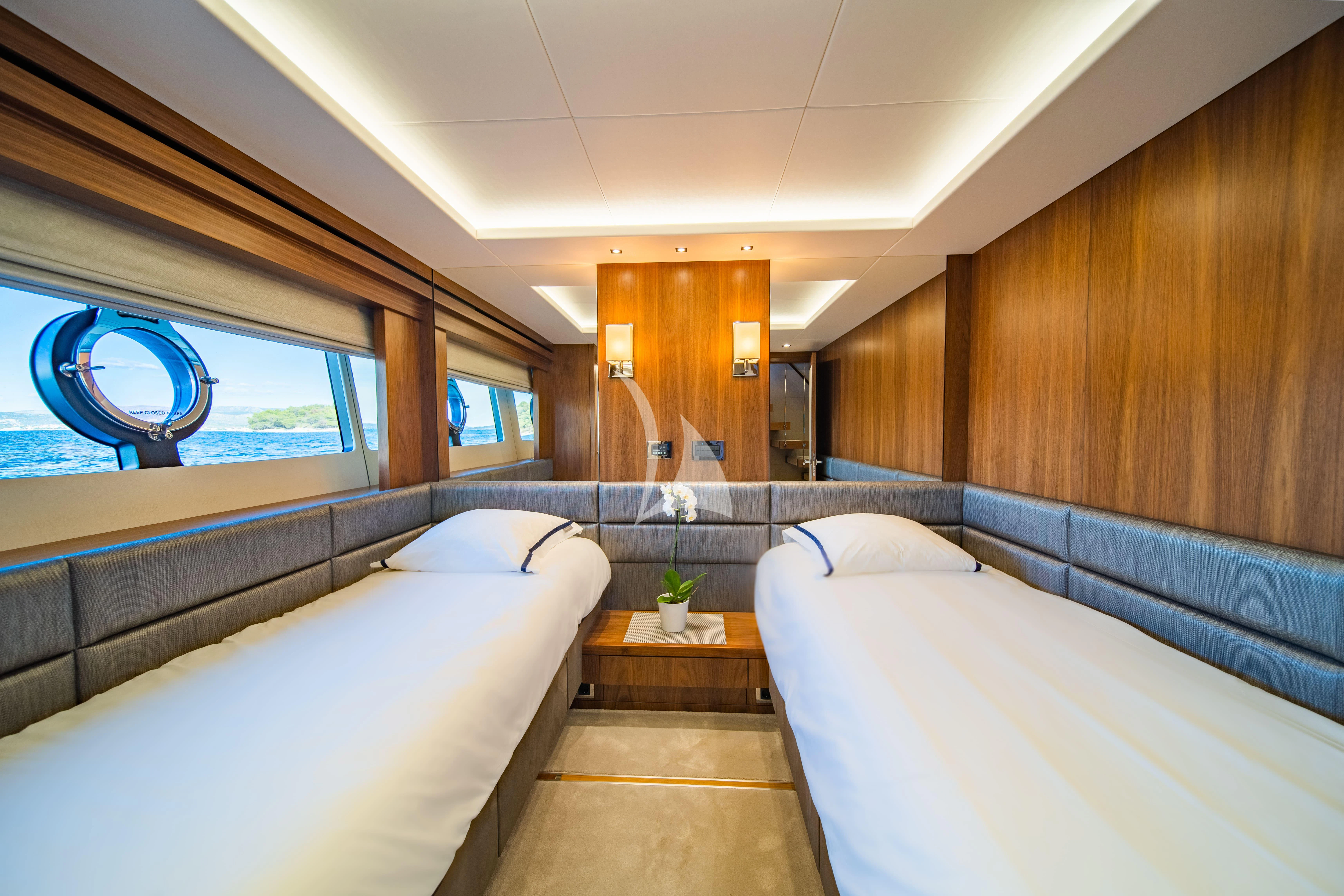 a room with two beds aboard BLACK MAMBA Yacht for Charter