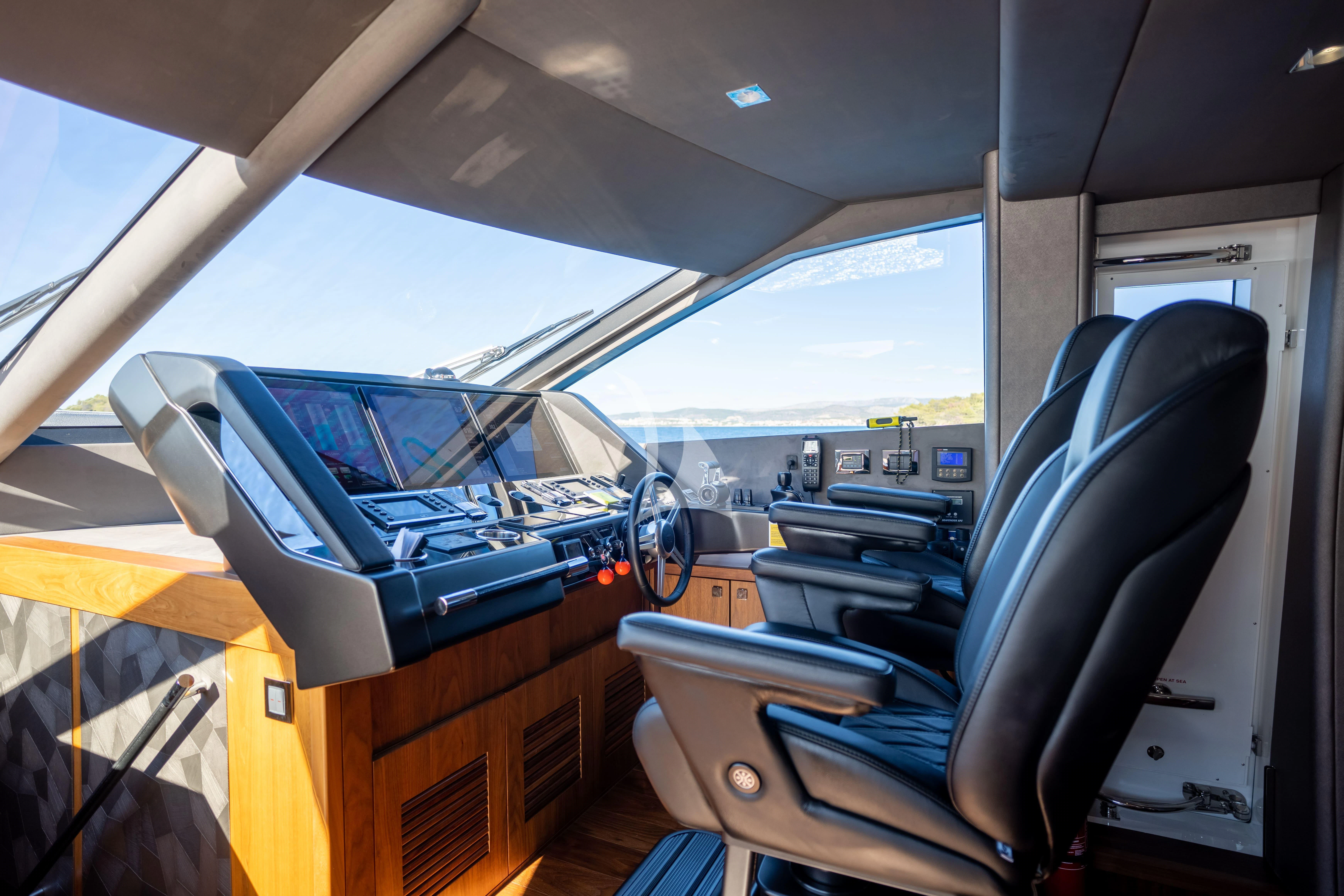 inside of a car aboard BLACK MAMBA Yacht for Charter