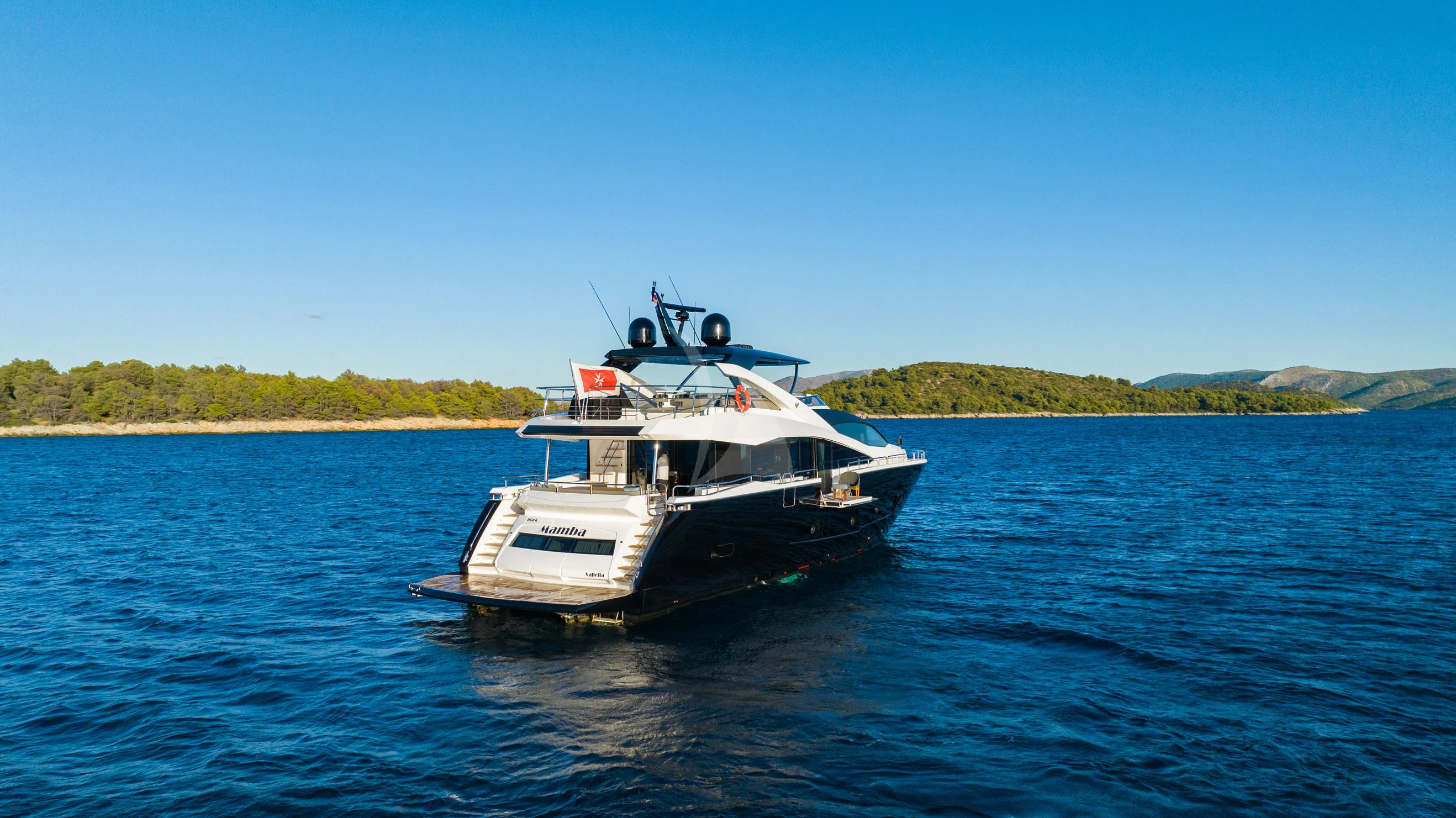 a boat on the water aboard BLACK MAMBA Yacht for Charter
