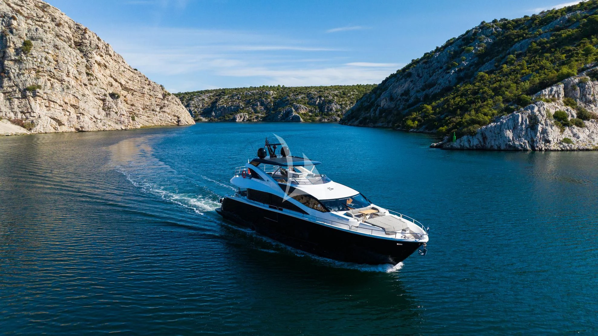a boat on the water aboard BLACK MAMBA Yacht for Charter