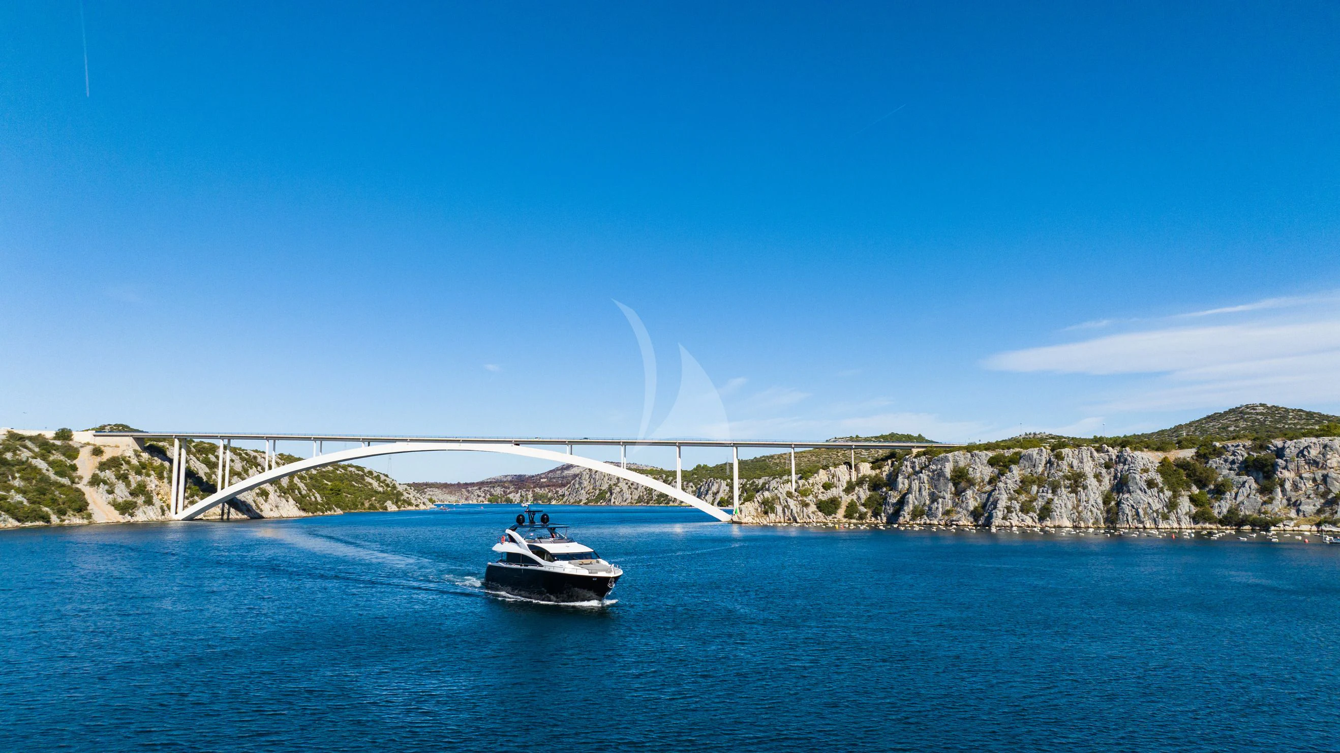 a boat sailing on water aboard BLACK MAMBA Yacht for Charter