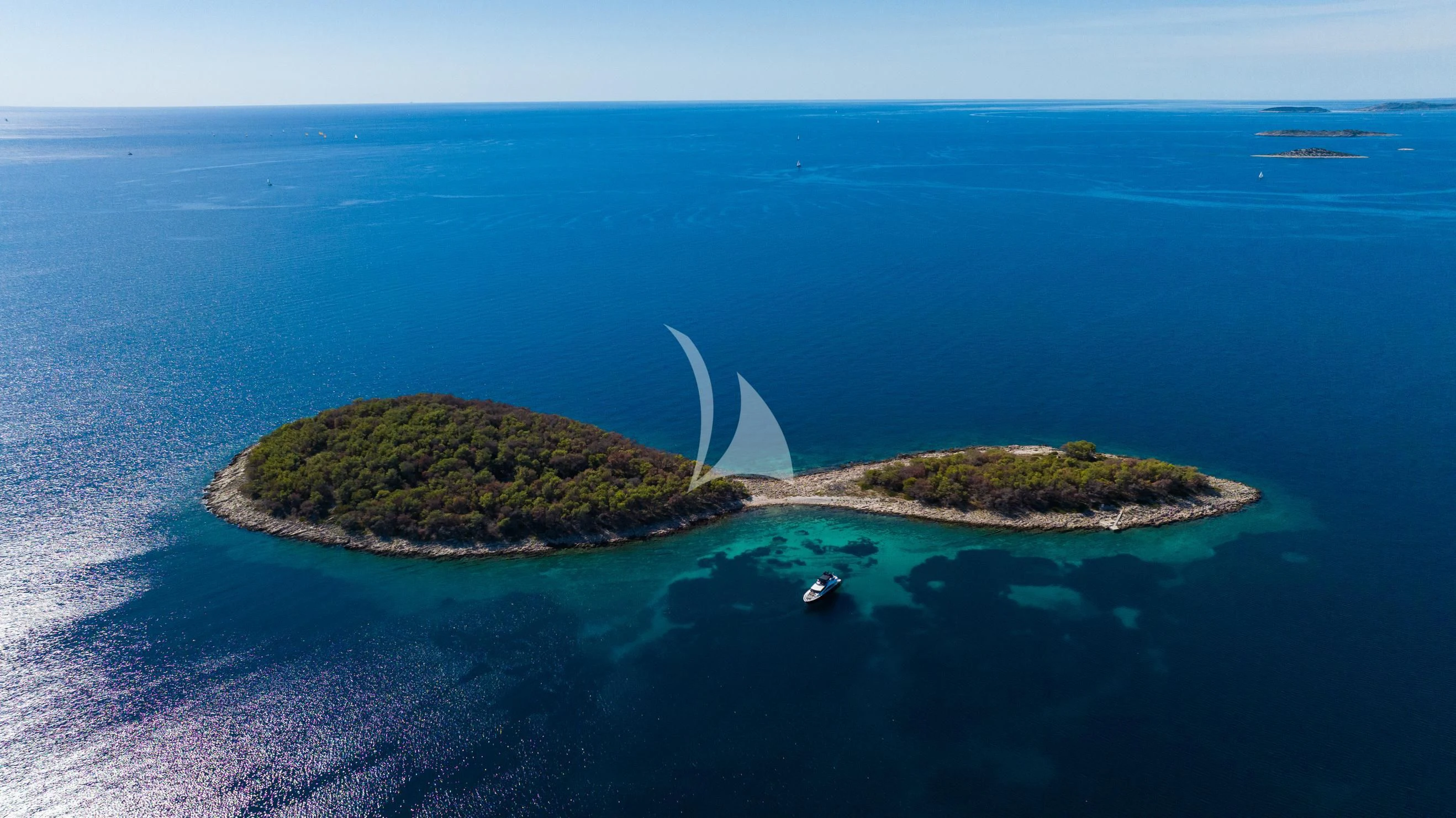an island with a small island aboard BLACK MAMBA Yacht for Charter