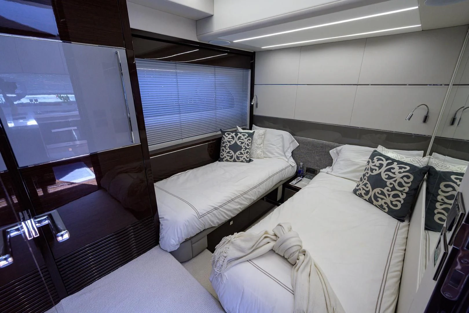 a room with a bed and a window aboard NIGHT STAR Yacht for Sale