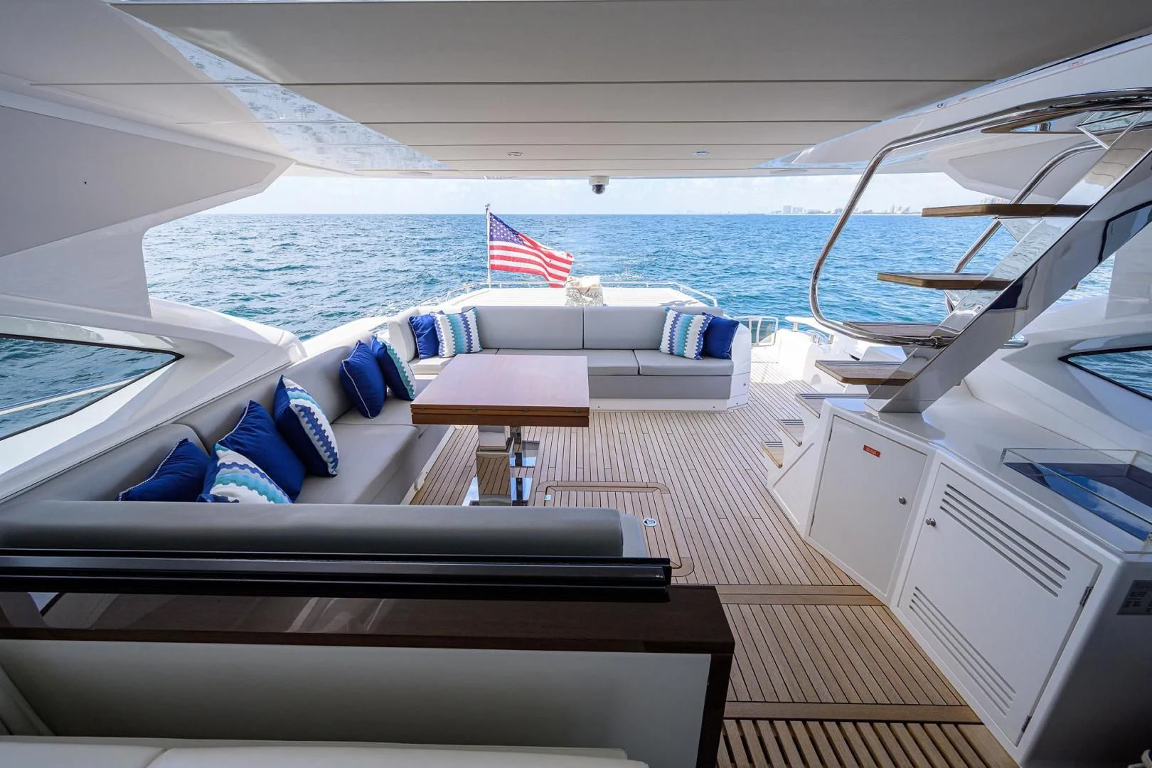 a boat with a flag on the deck aboard NIGHT STAR Yacht for Sale