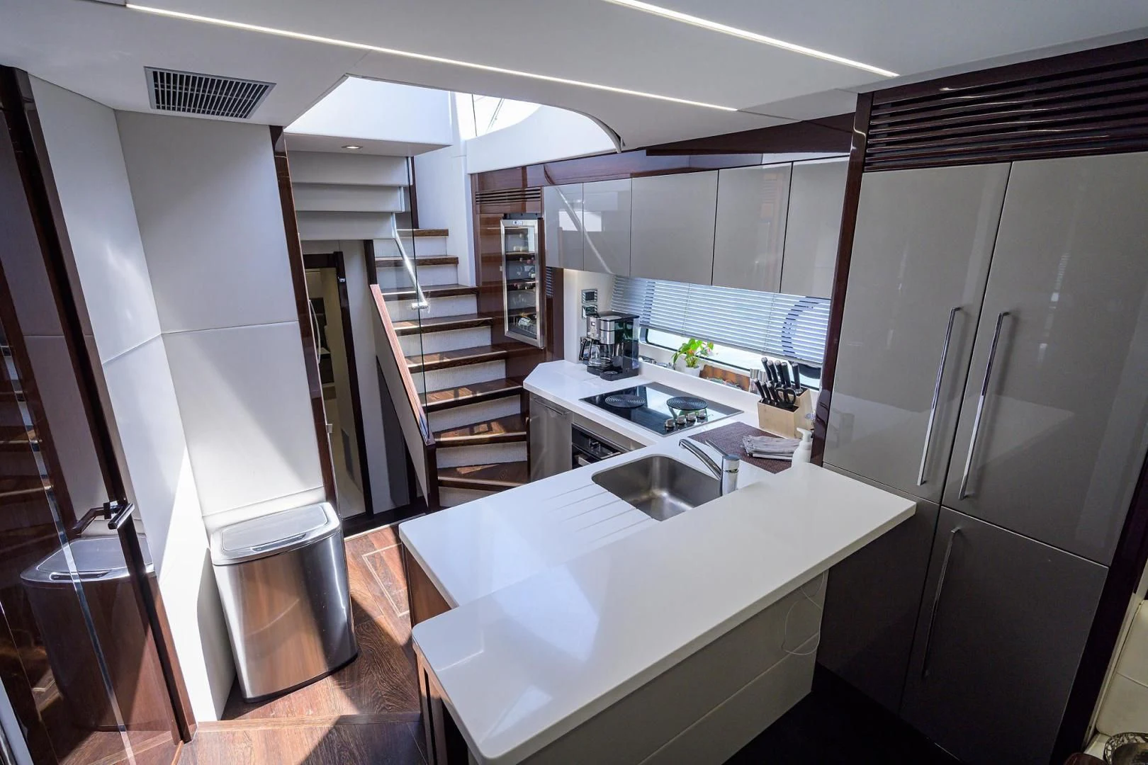 a kitchen with a large island aboard NIGHT STAR Yacht for Sale