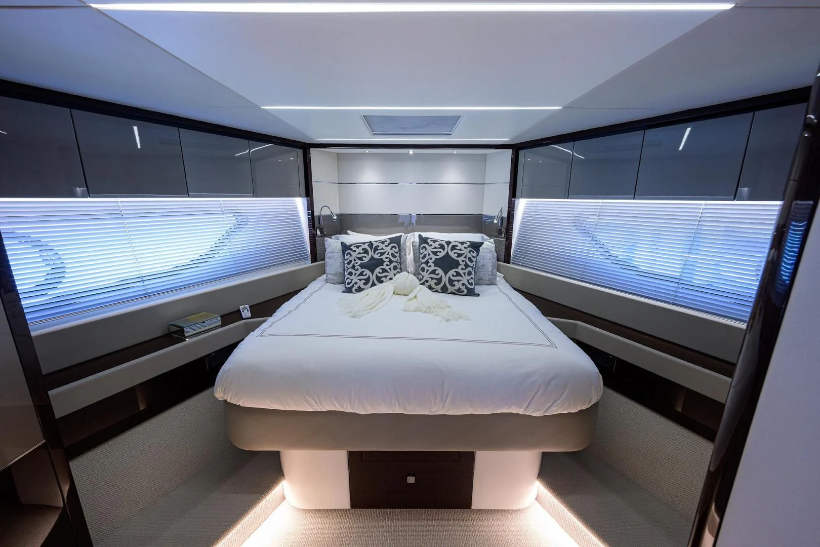 a room with a bed and a window aboard NIGHT STAR Yacht for Sale
