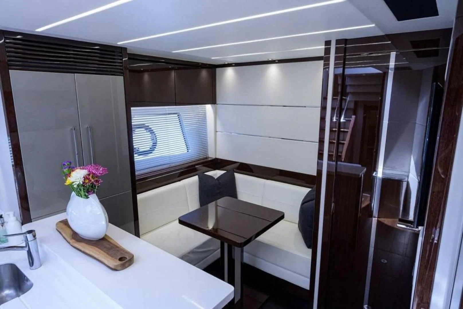 a room with a table and chairs aboard NIGHT STAR Yacht for Sale