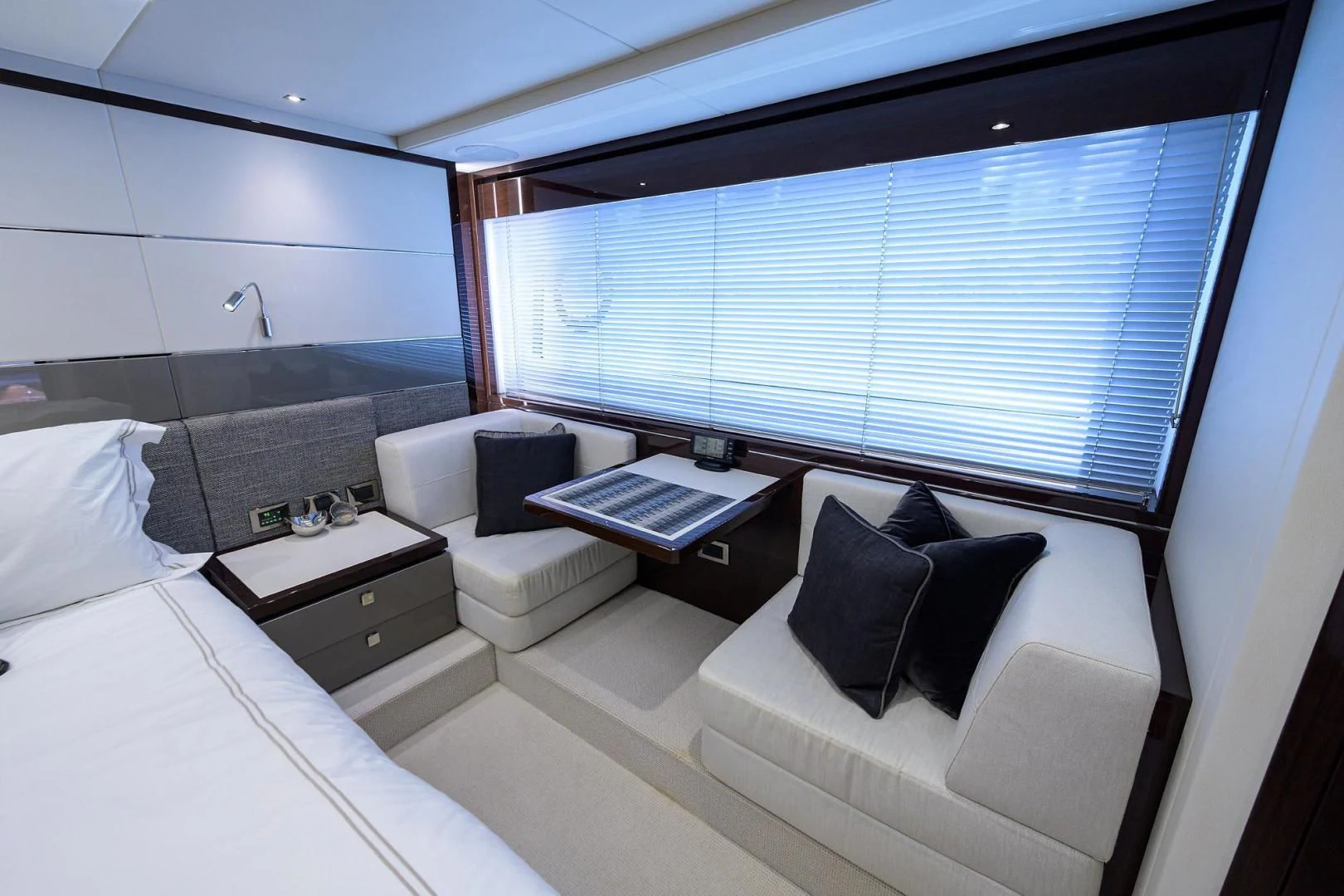 a room with a bed and a window aboard NIGHT STAR Yacht for Sale