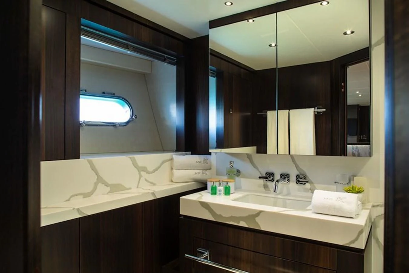 a bathroom with a large mirror aboard MR K IRISTON Yacht for Sale