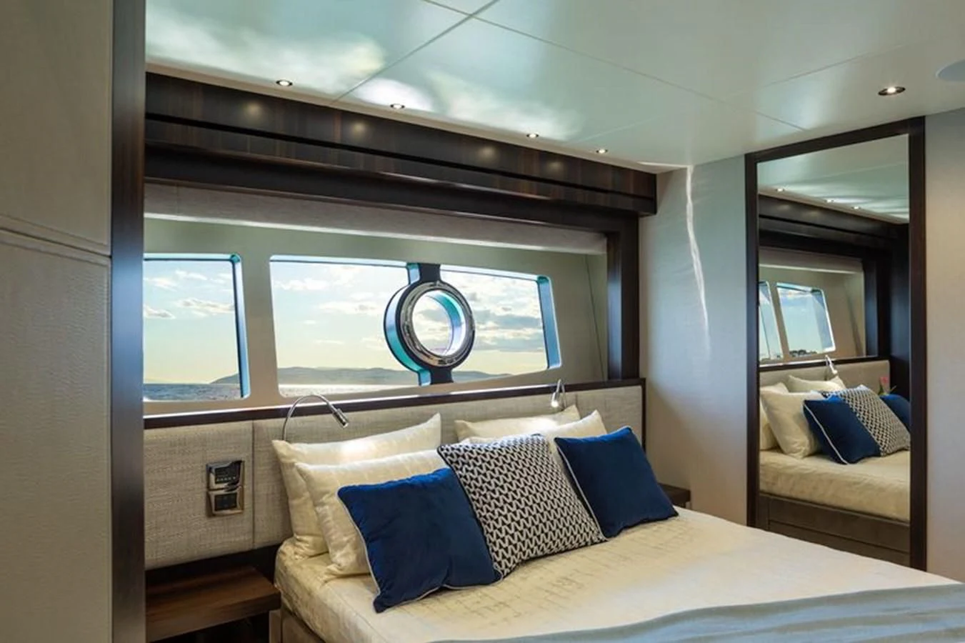 a bed with a white bed spread aboard MR K IRISTON Yacht for Sale
