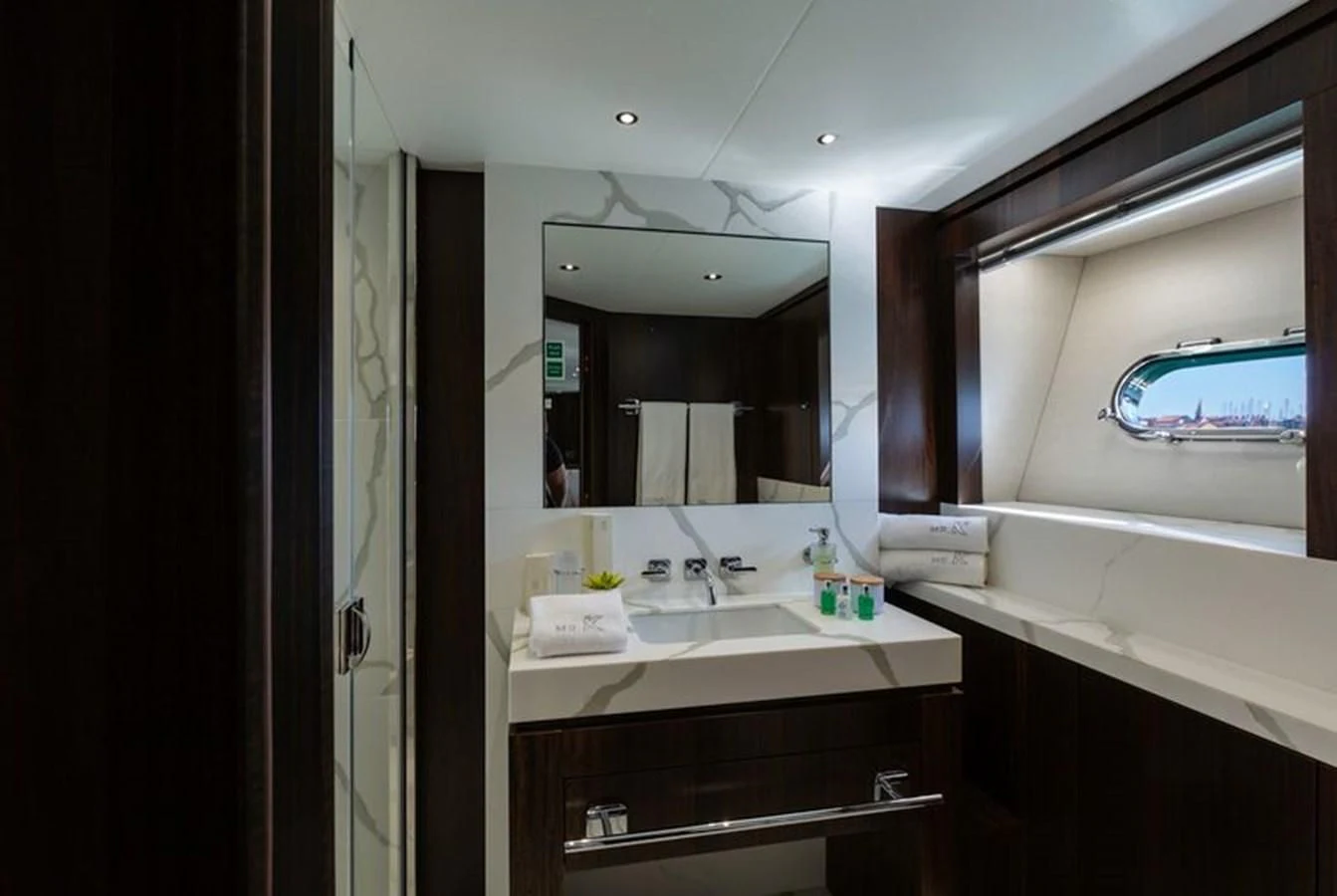 a bathroom with a large mirror aboard MR K IRISTON Yacht for Sale