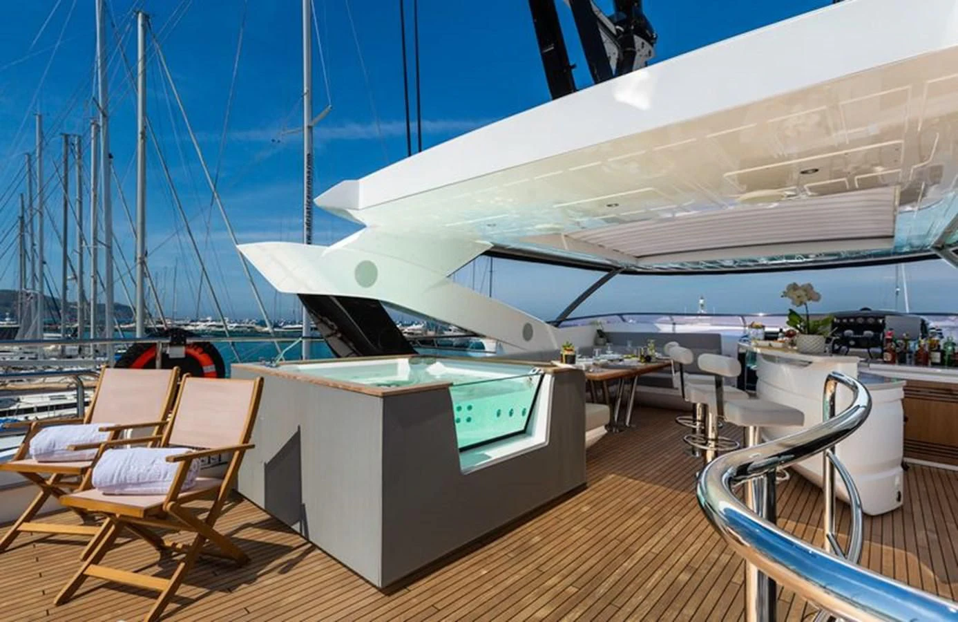 a large white boat on a dock aboard MR K IRISTON Yacht for Sale