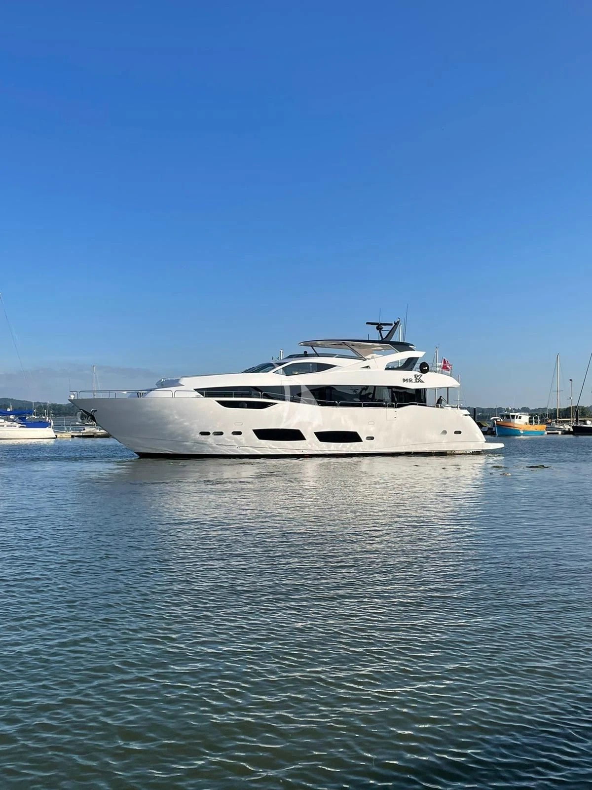 a white yacht in the water aboard MR K IRISTON Yacht for Sale