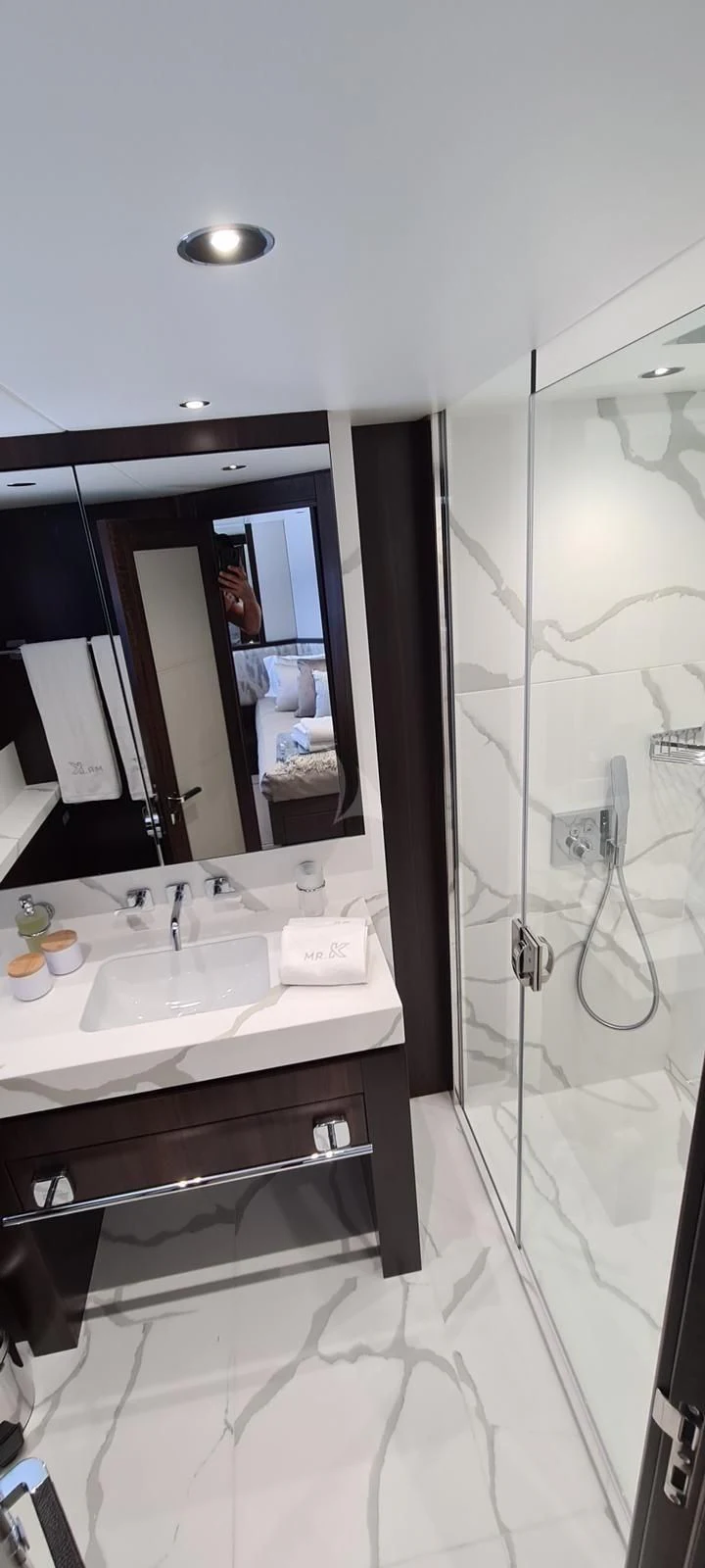 a bathroom with a shower and sink aboard MR K IRISTON Yacht for Sale