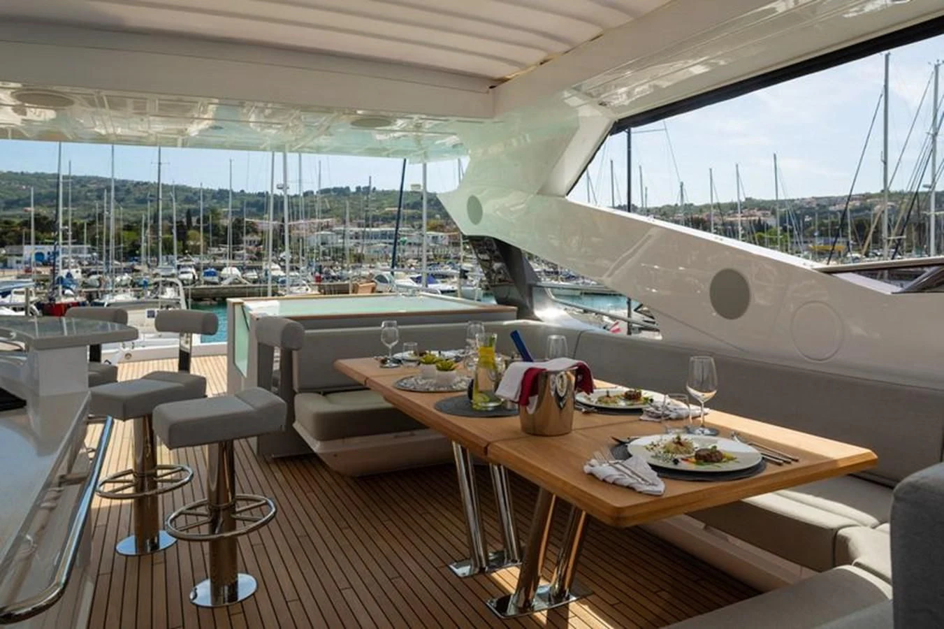 a table with plates and cups on it aboard MR K IRISTON Yacht for Sale