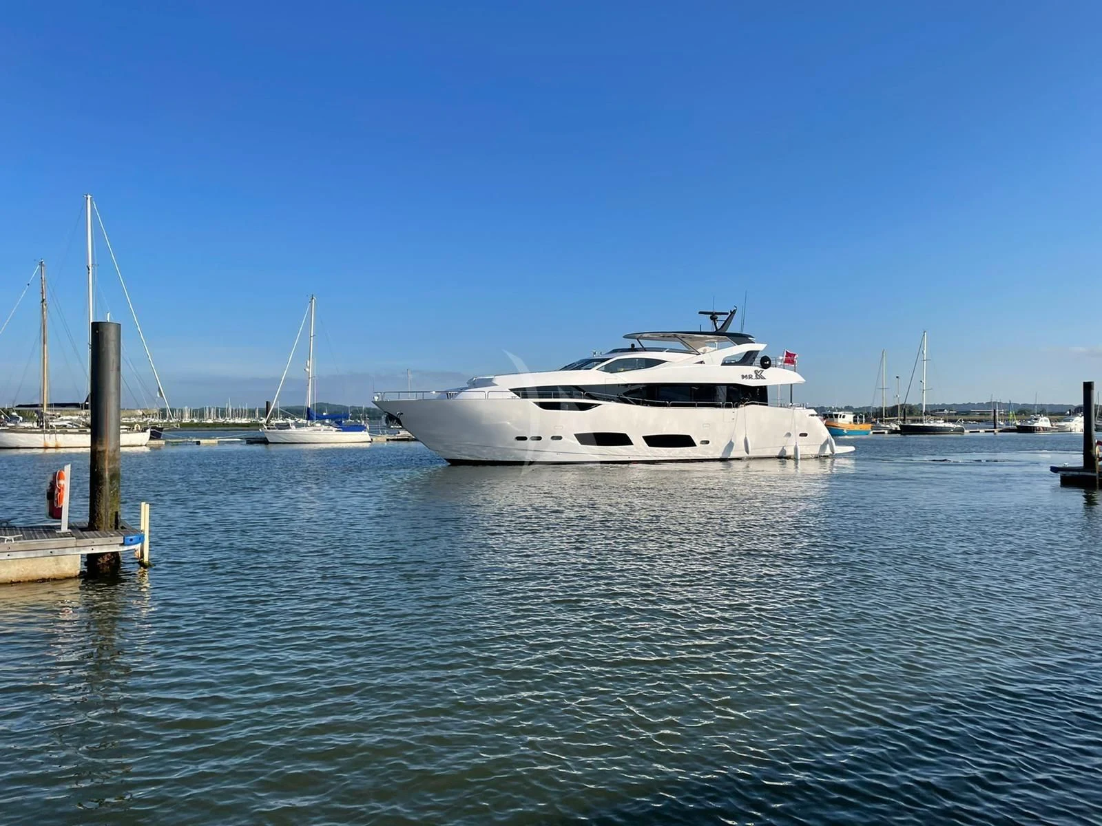 a white yacht in the water aboard MR K IRISTON Yacht for Sale