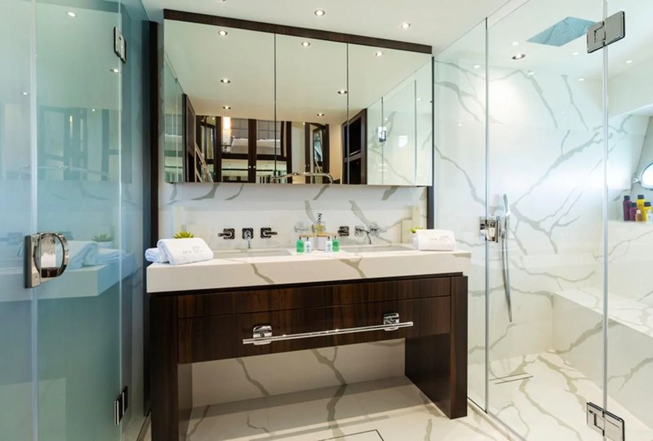 a bathroom with a large mirror aboard MR K IRISTON Yacht for Sale