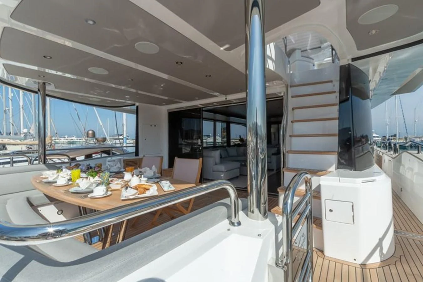 a large room with a table and chairs aboard MR K IRISTON Yacht for Sale