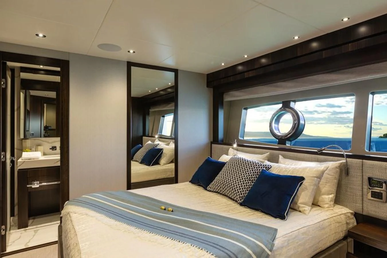 a bedroom with a large bed aboard MR K IRISTON Yacht for Sale
