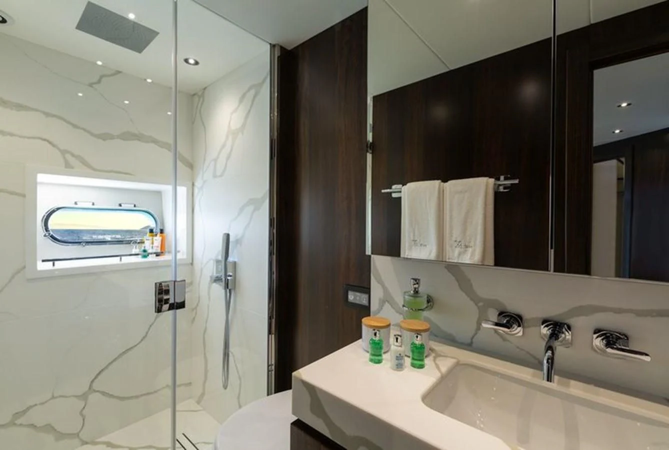a bathroom with a shower and sink aboard MR K IRISTON Yacht for Sale