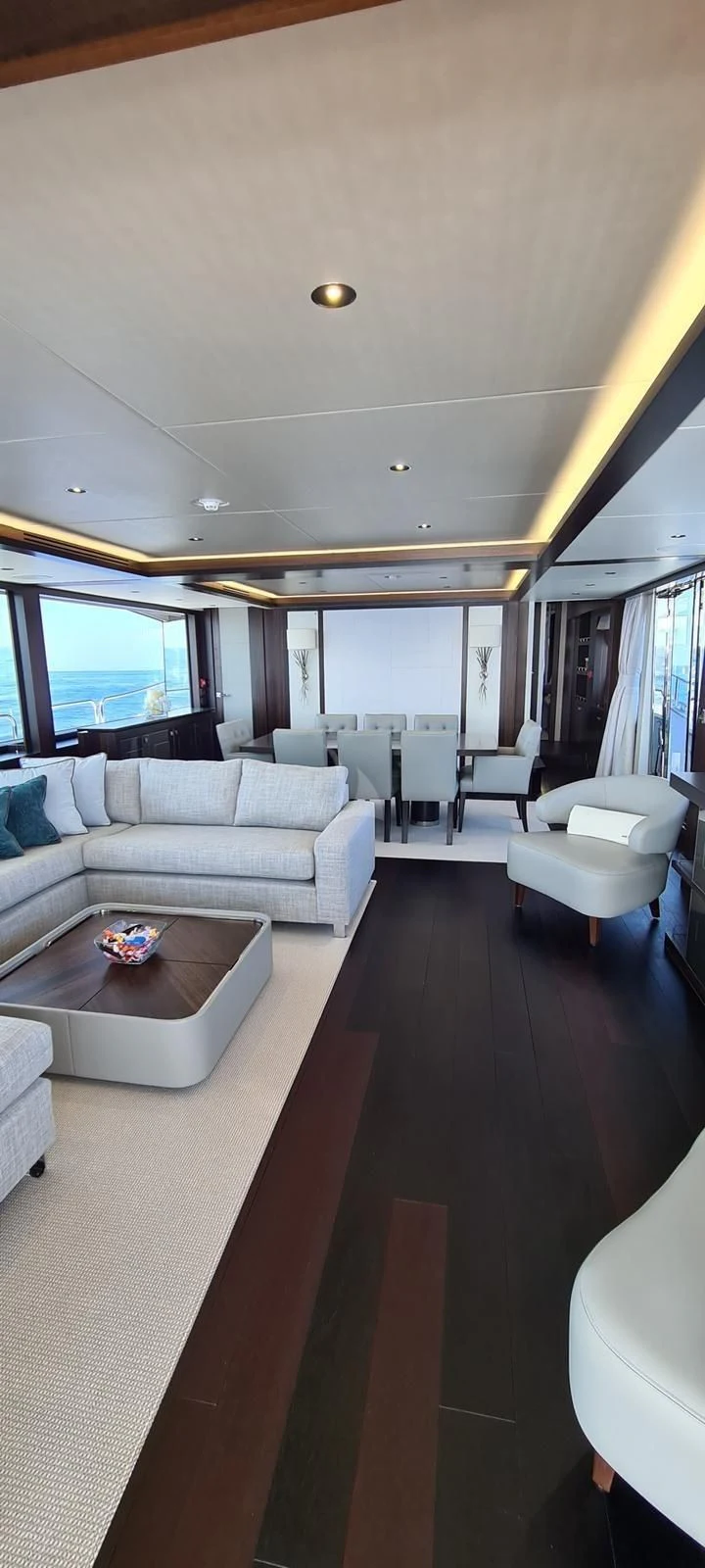a living room with a couch and a coffee table aboard MR K IRISTON Yacht for Sale
