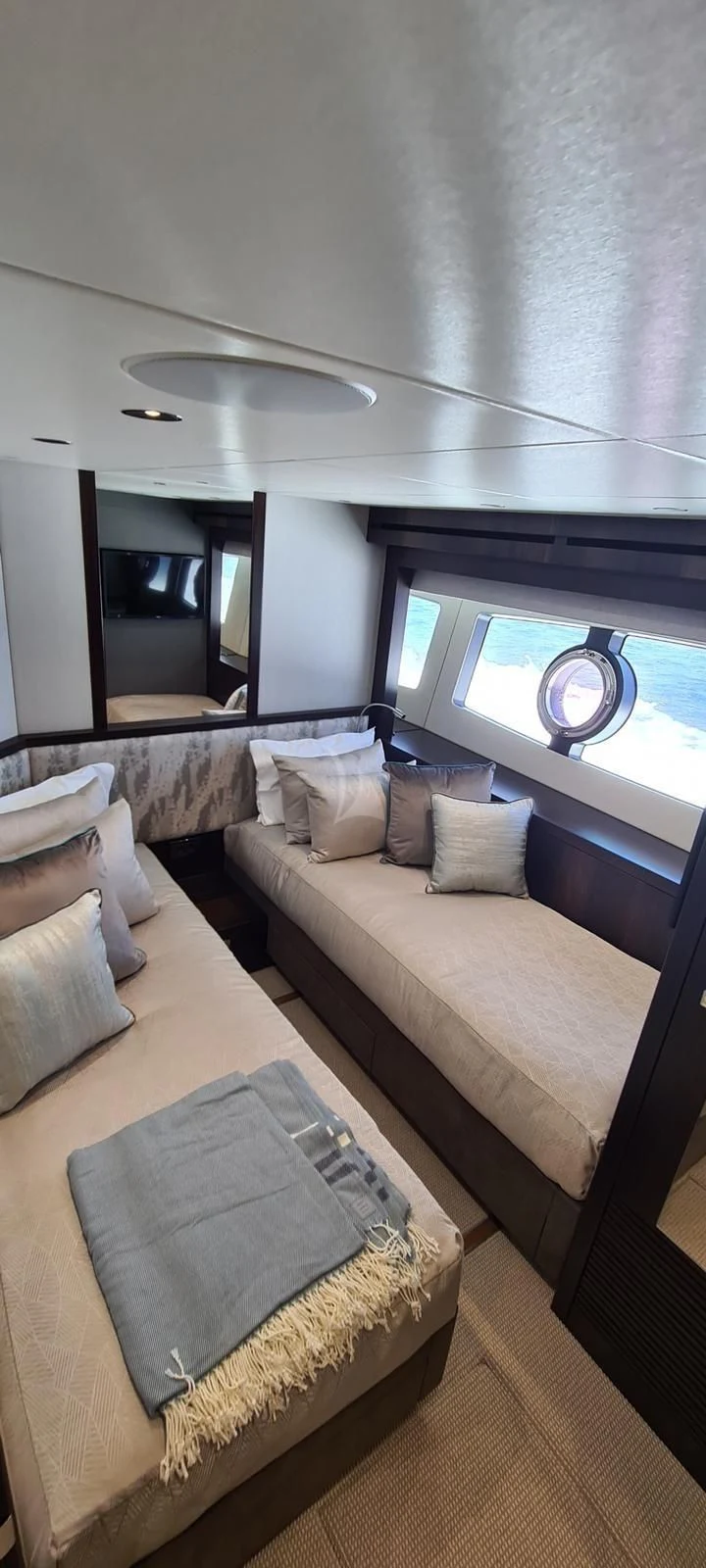 a bed with a round pillow aboard MR K IRISTON Yacht for Sale