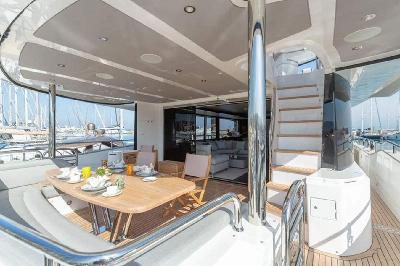 a large room with a table and chairs aboard MR K IRISTON Yacht for Sale