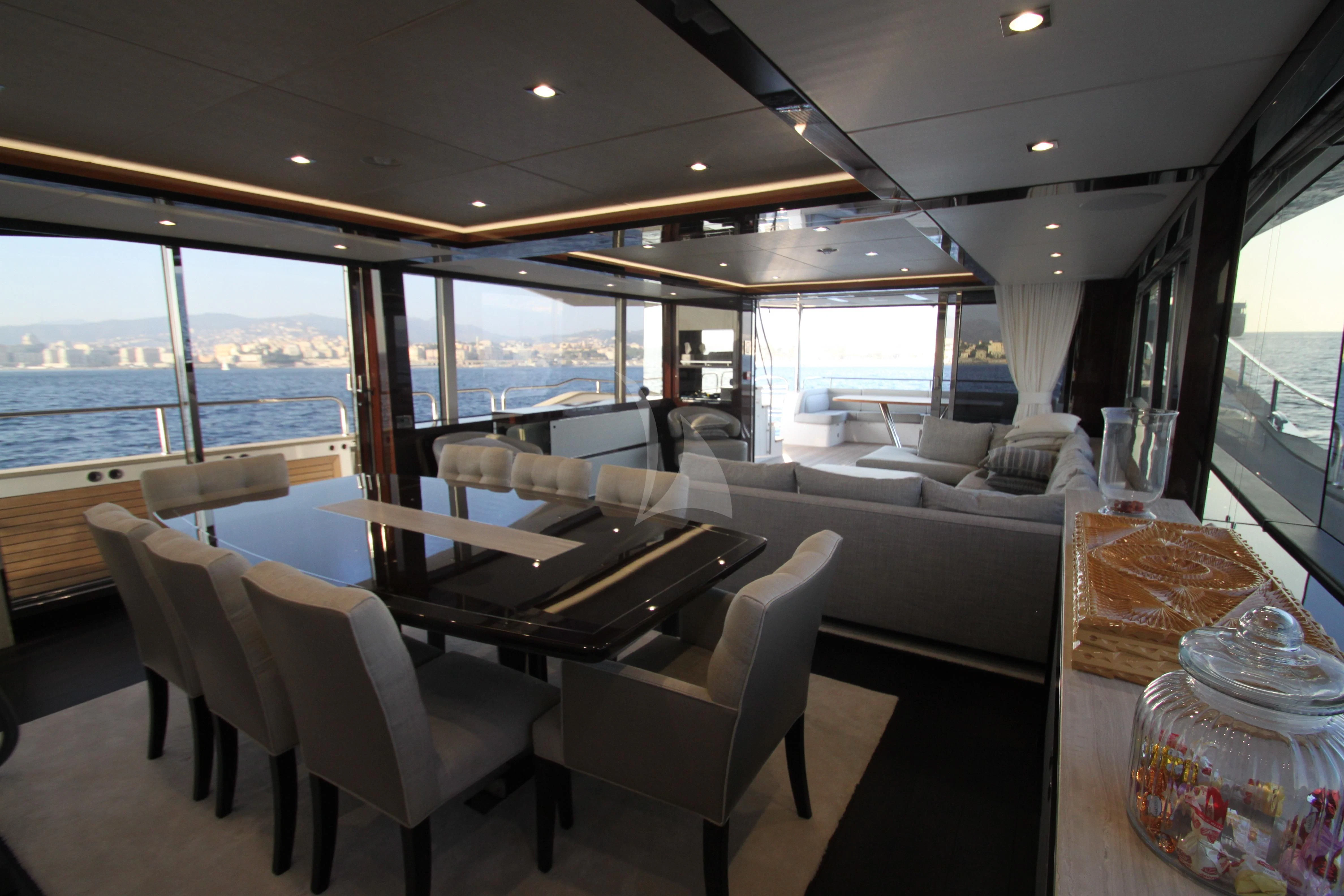 a bus with a table and chairs aboard MR K IRISTON Yacht for Sale