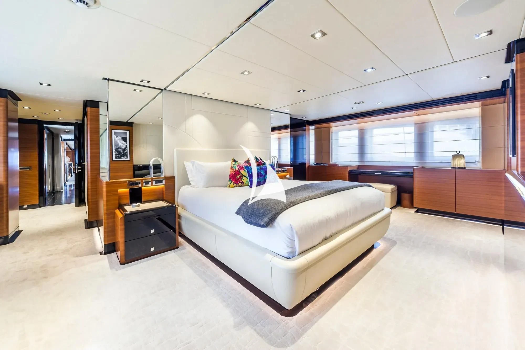 a white couch in a room aboard DAISY D Yacht for Sale