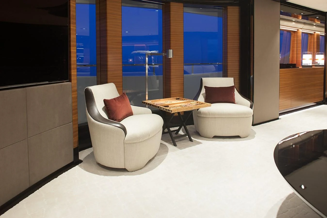 a room with a table and chairs aboard DAISY D Yacht for Sale