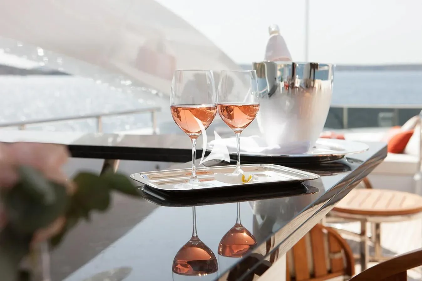 a table with wine glasses aboard DAISY D Yacht for Sale