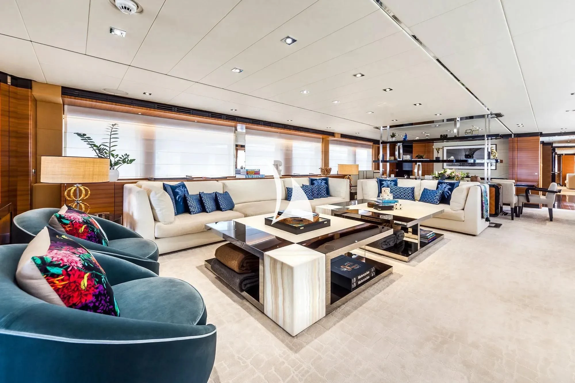 a living room with a couch and a table aboard DAISY D Yacht for Sale
