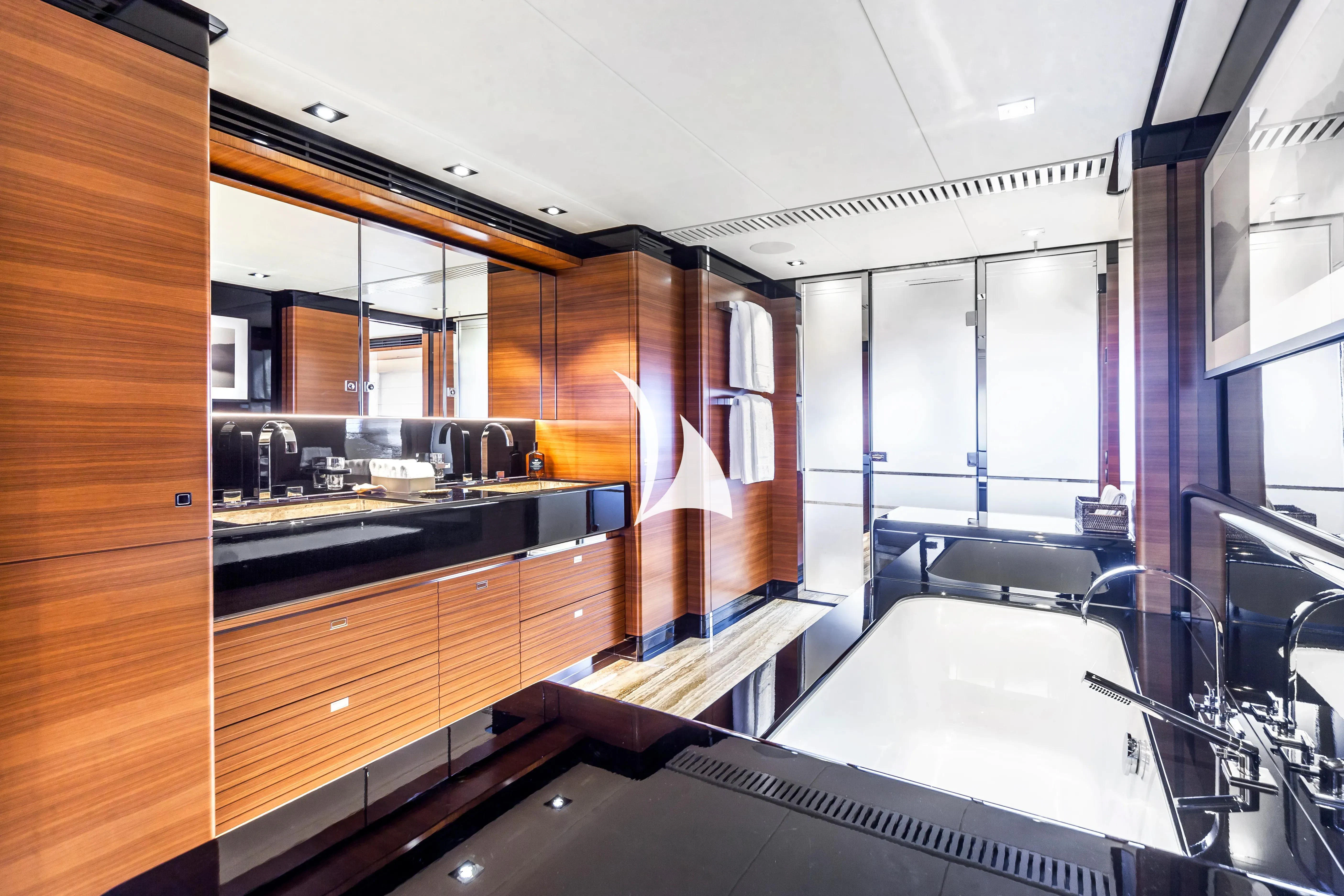 a kitchen with wooden cabinets aboard DAISY D Yacht for Sale