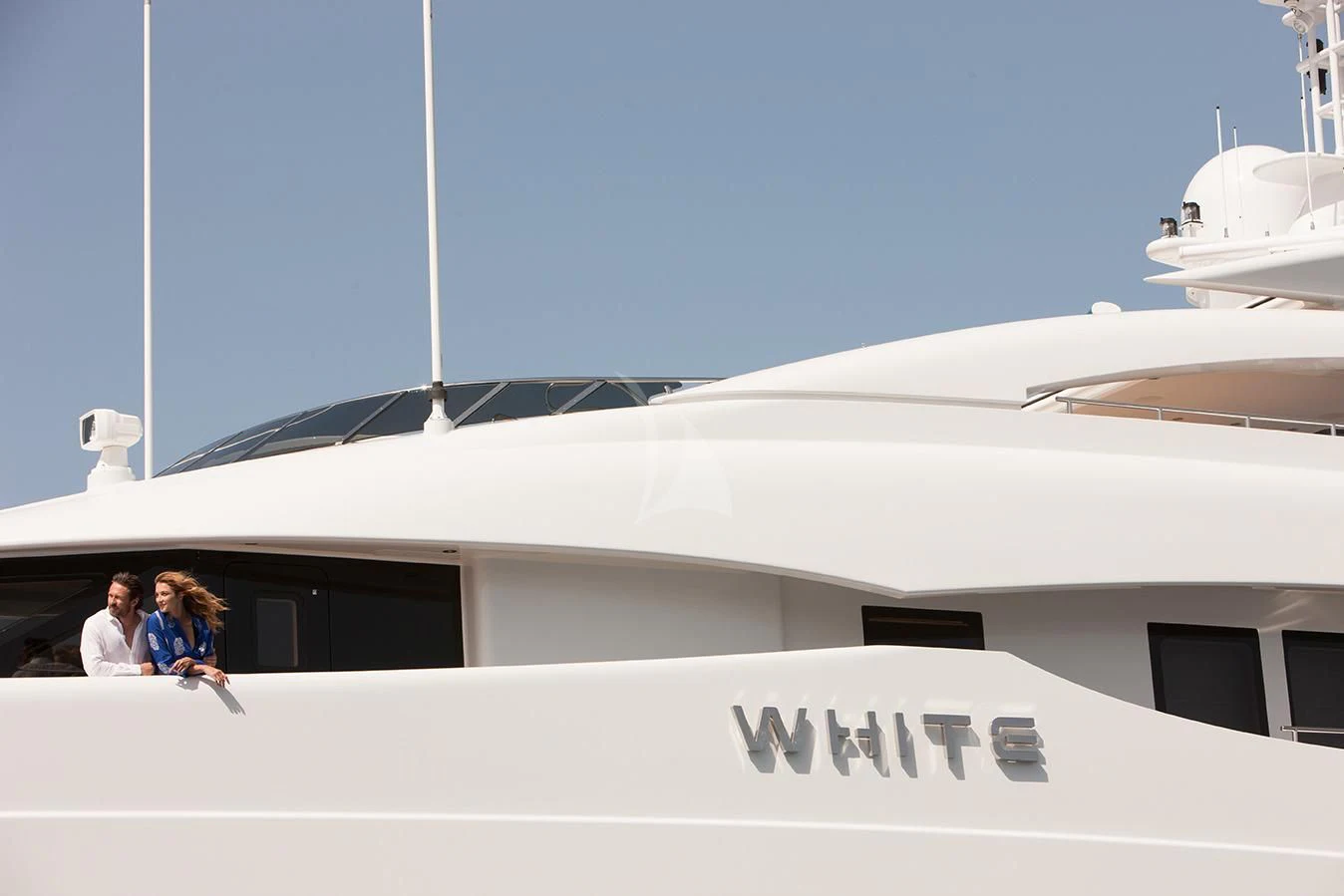 a group of people sitting in a white building aboard DAISY D Yacht for Sale