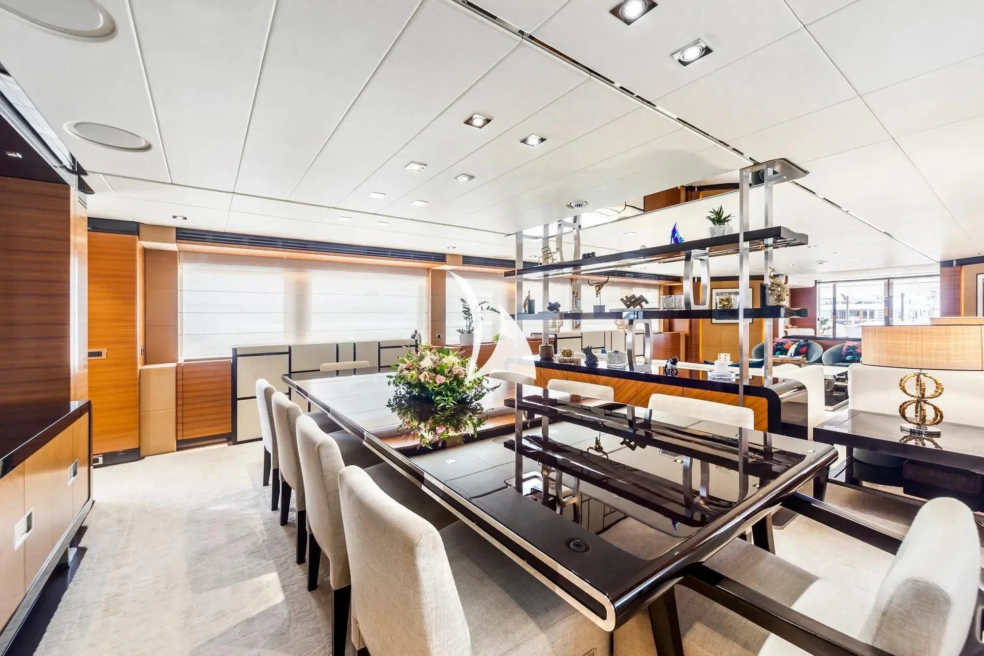 a room with tables and chairs aboard DAISY D Yacht for Sale