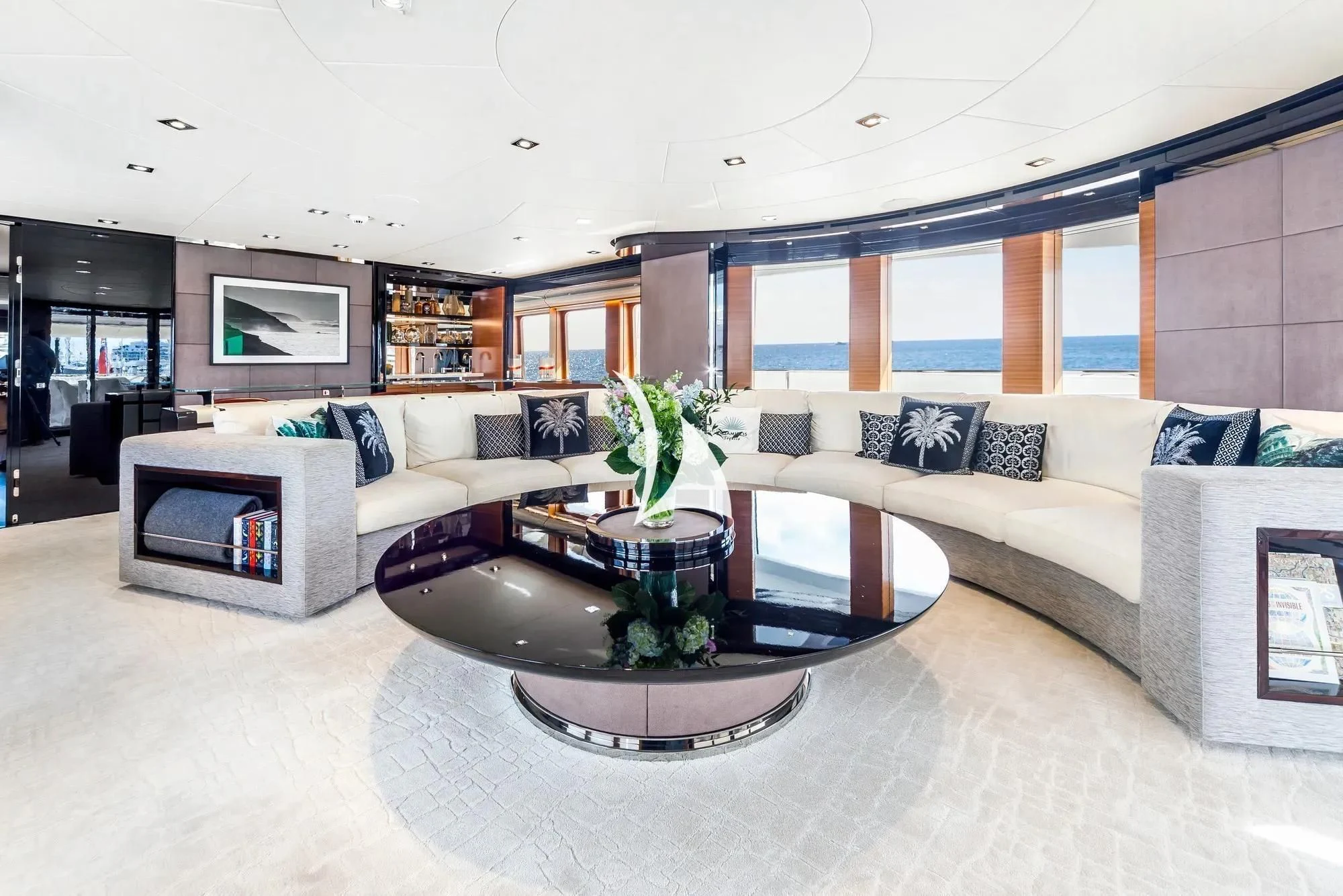a living room with a couch and a table aboard DAISY D Yacht for Sale