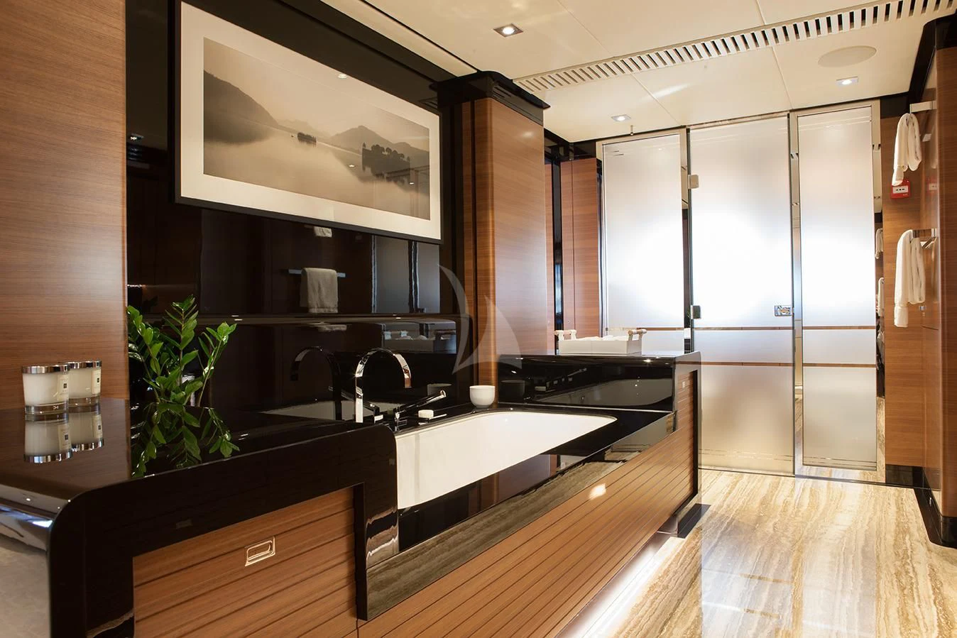 a kitchen with a large island aboard DAISY D Yacht for Sale