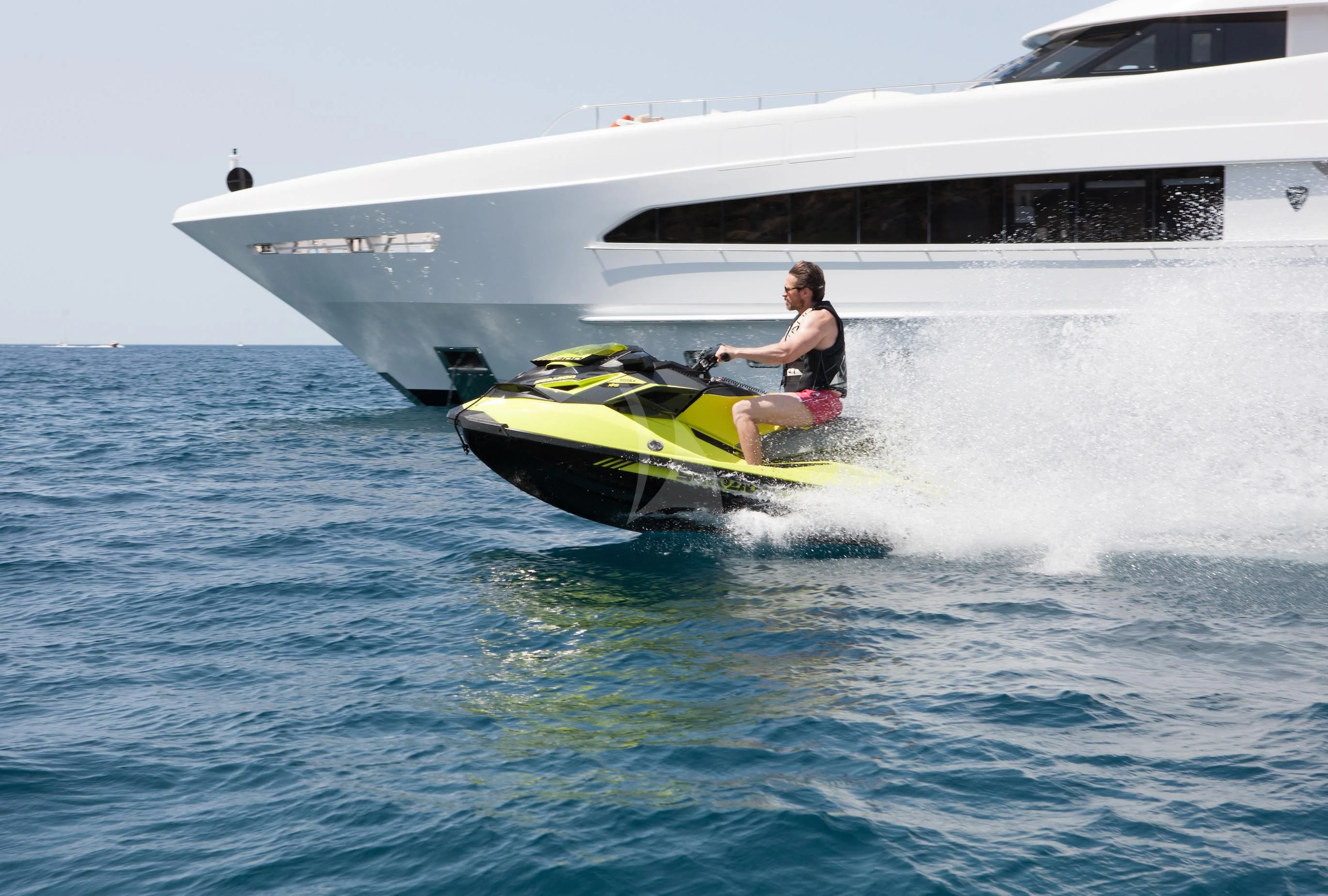 a man on a jet ski aboard DAISY D Yacht for Sale