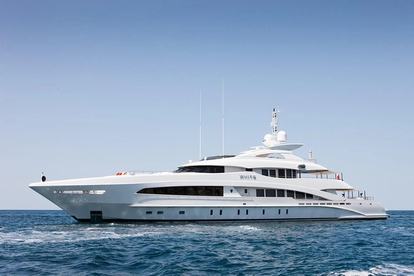 a white yacht in the water aboard DAISY D Yacht for Sale