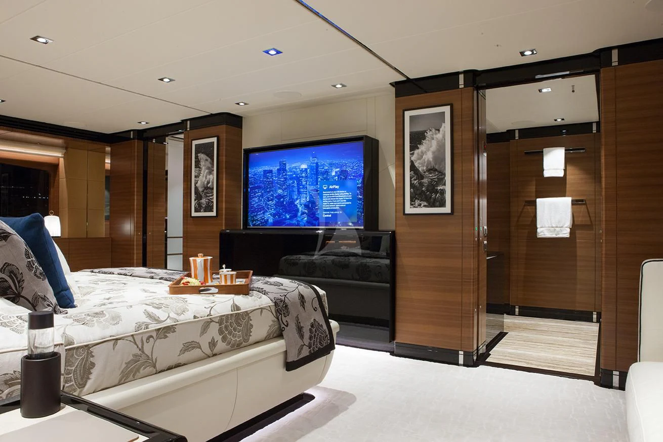 a room with a bed and a tv aboard DAISY D Yacht for Sale