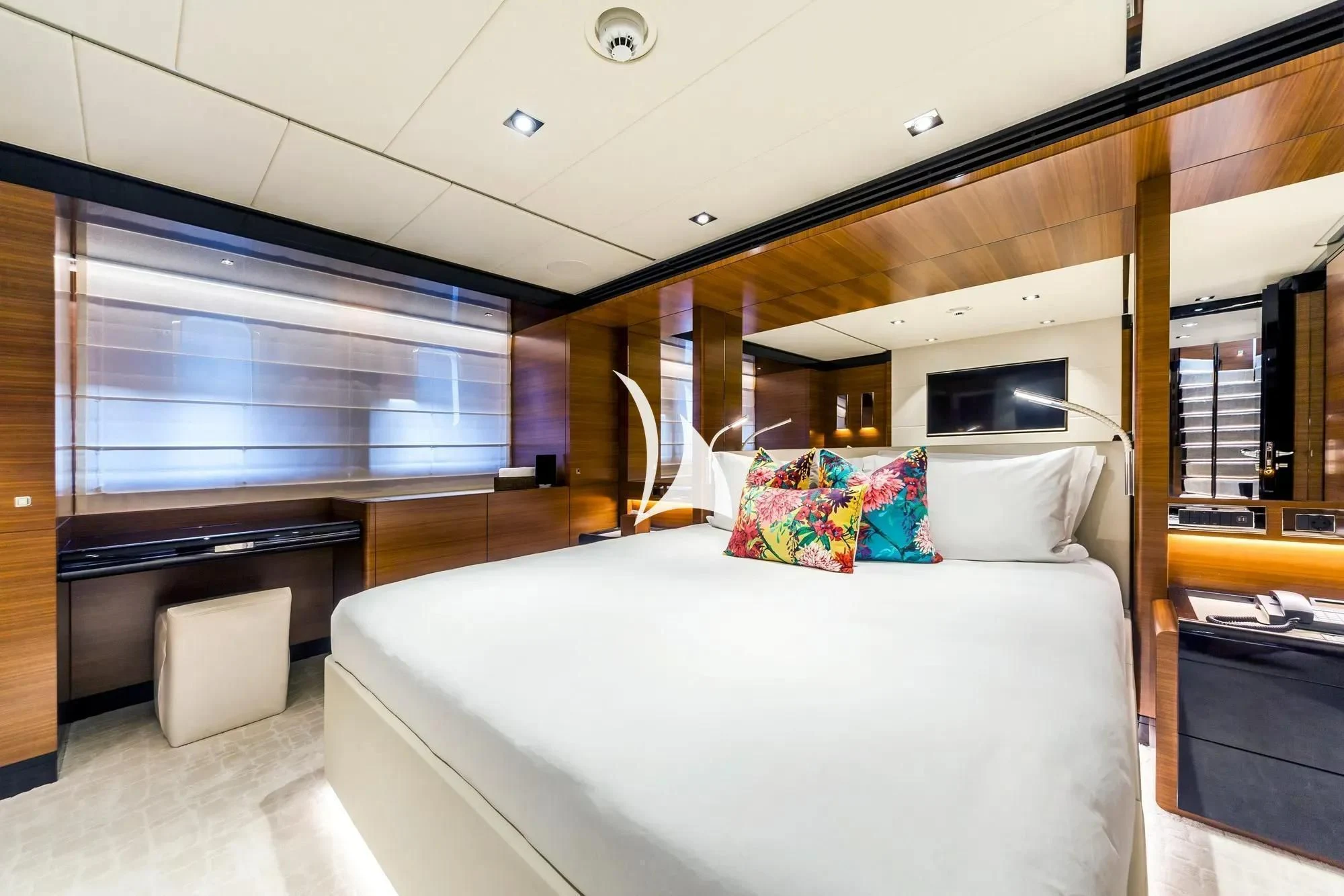 a room with a bed and a television aboard DAISY D Yacht for Sale