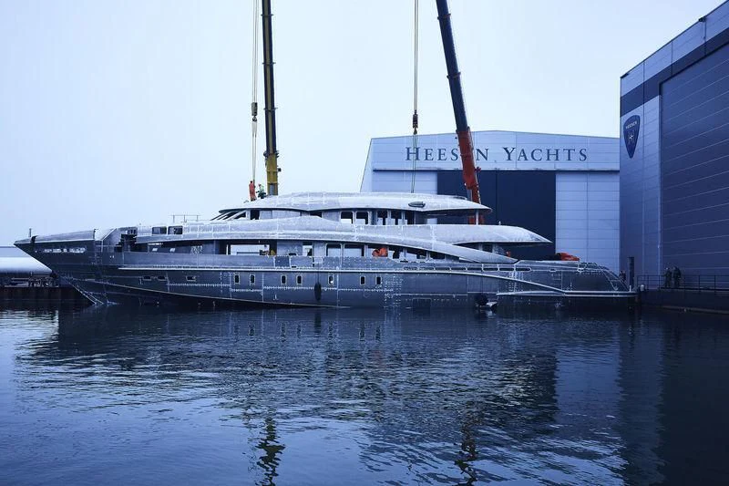 a large white boat in a body of water aboard DAISY D Yacht for Sale