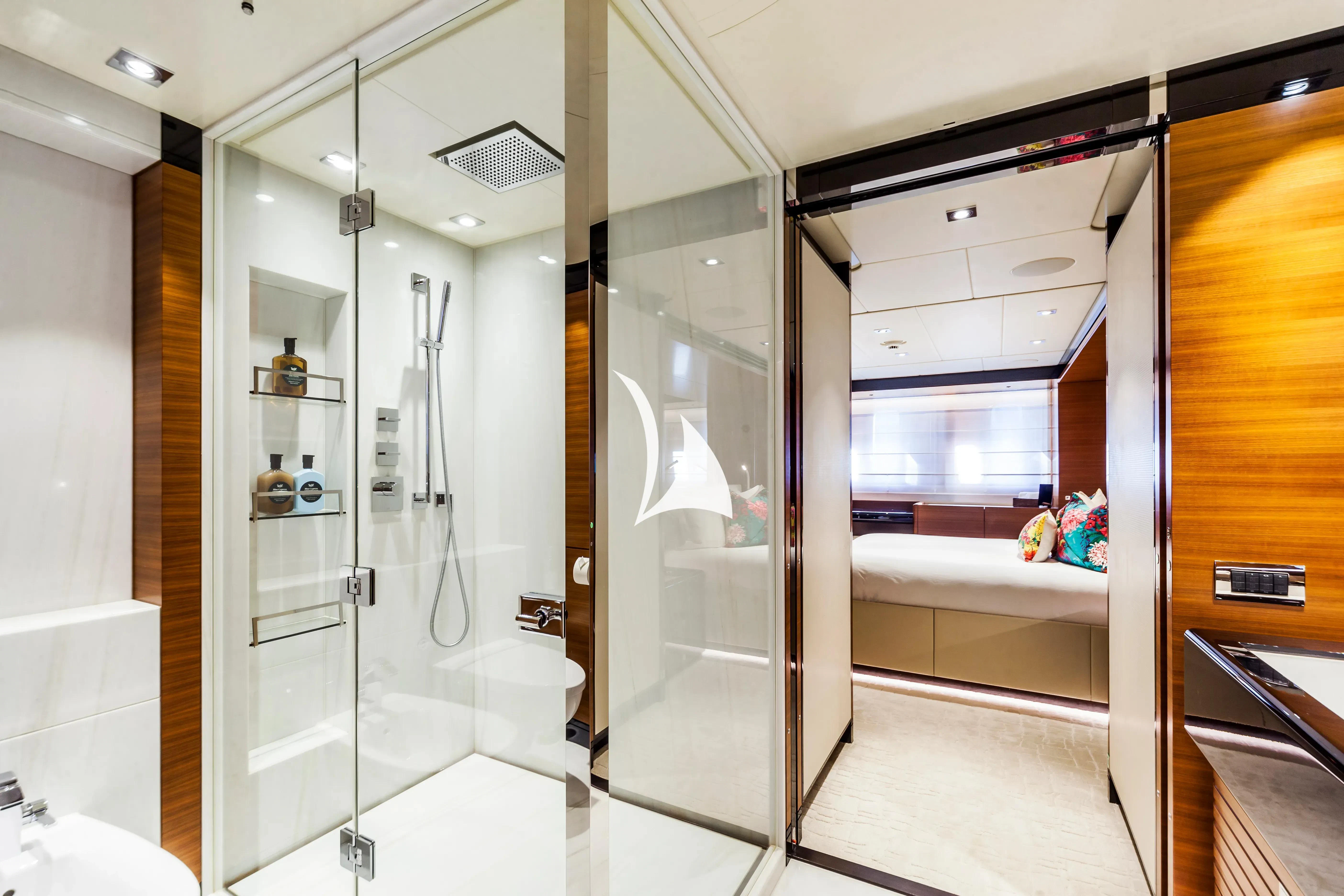 a bathroom with glass doors aboard DAISY D Yacht for Sale
