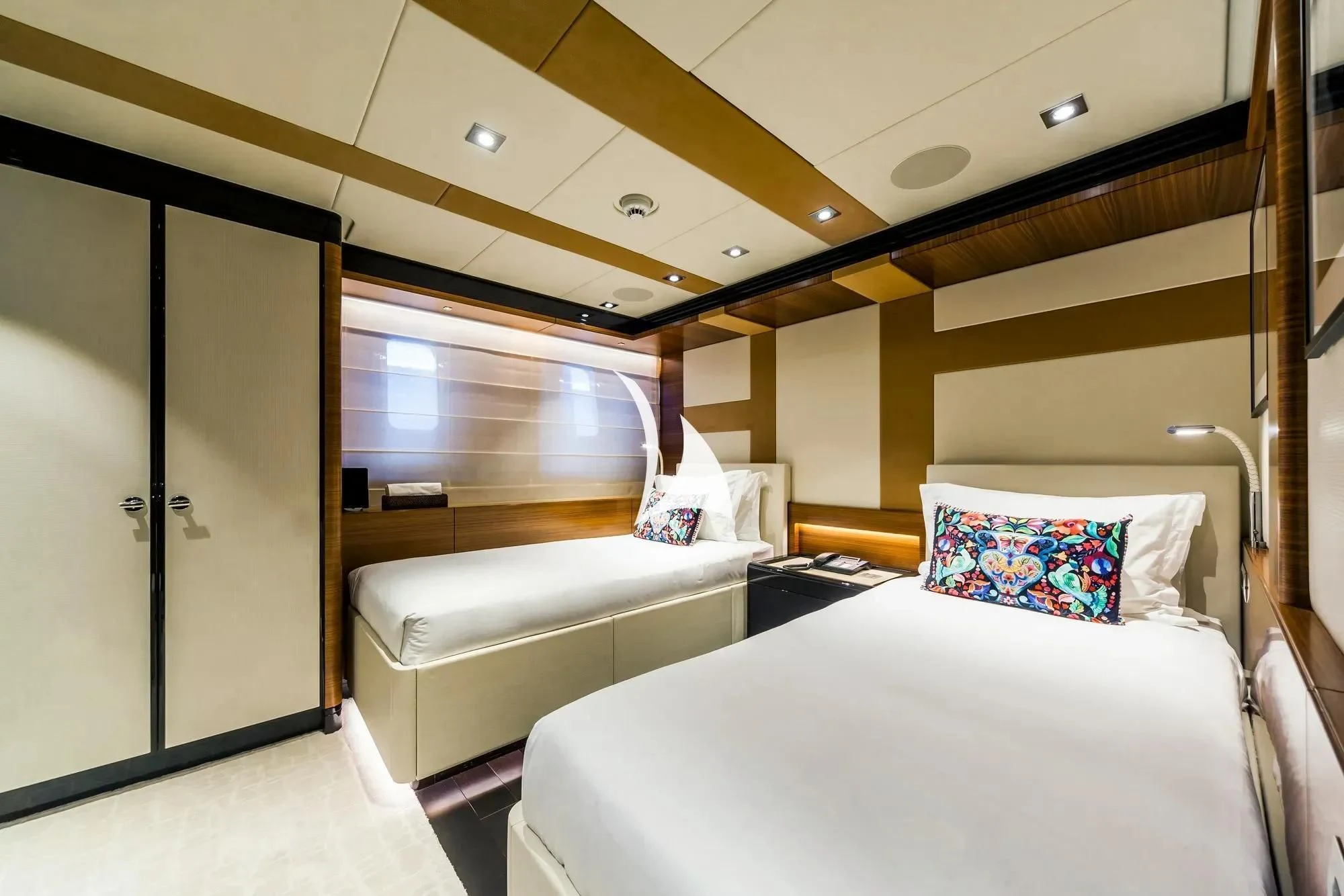a room with a bed and a door aboard DAISY D Yacht for Sale