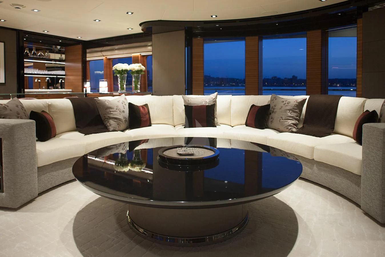 a living room with a large sofa aboard DAISY D Yacht for Sale