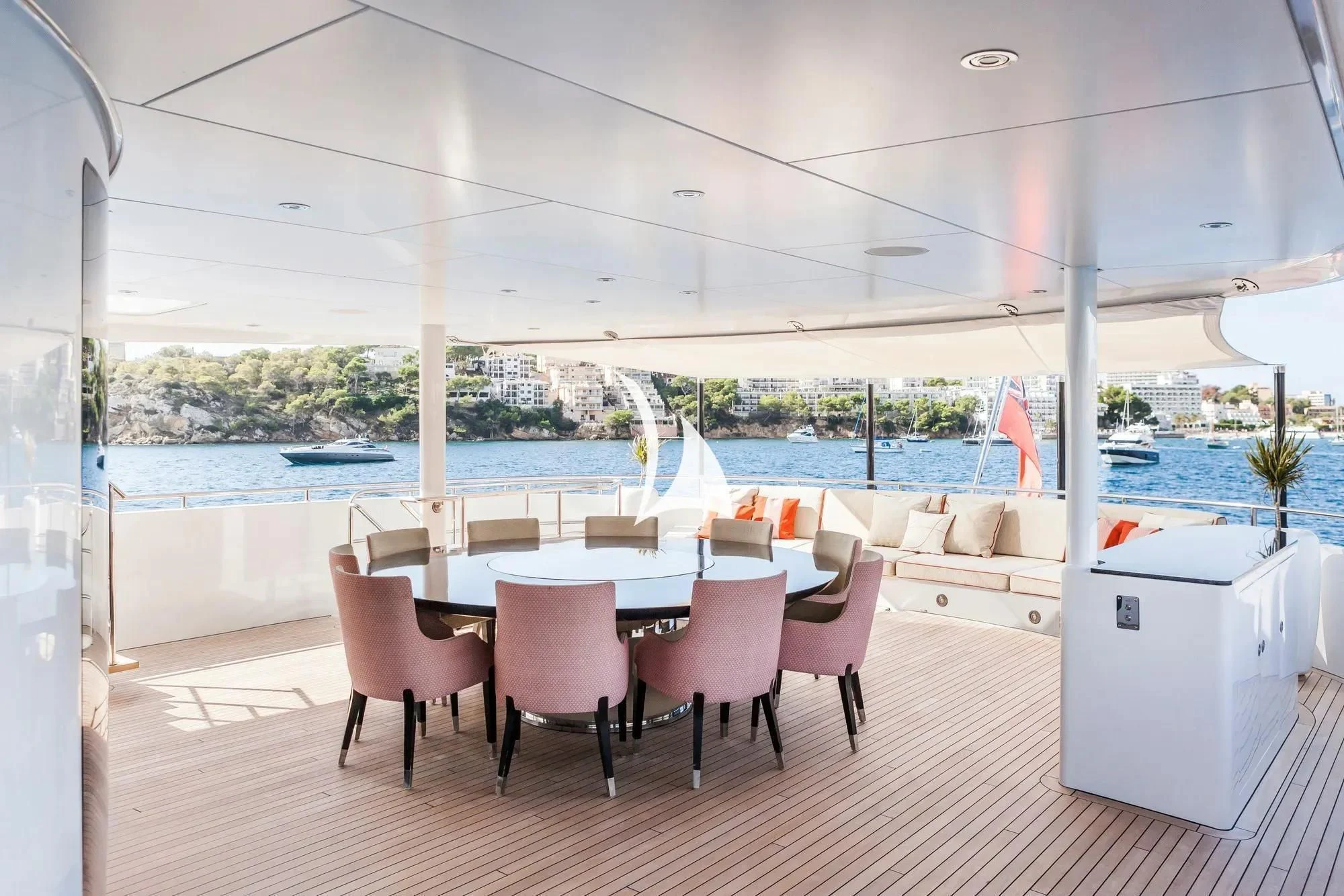 a room with a table and chairs aboard DAISY D Yacht for Sale