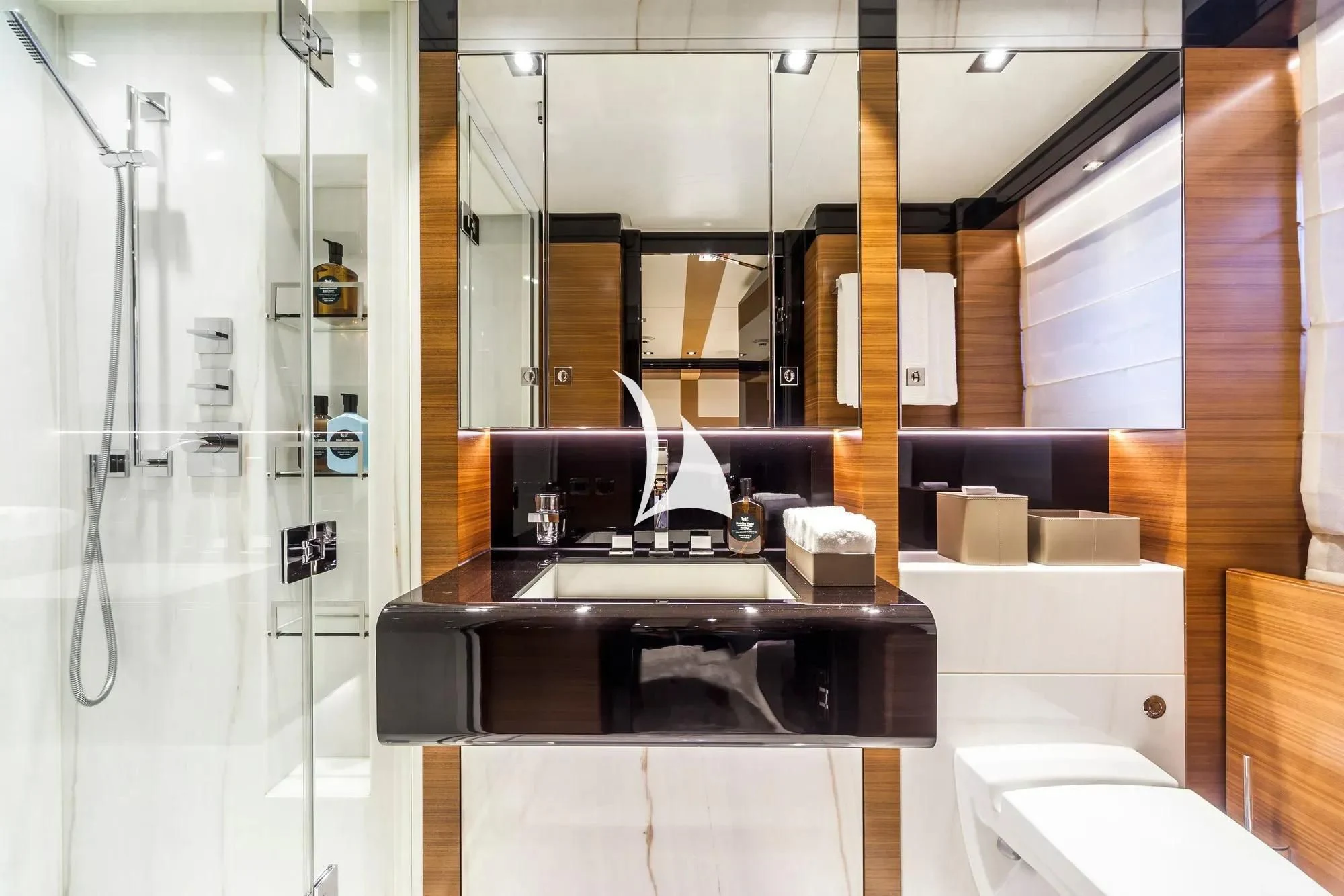 a bathroom with a sink and cabinets aboard DAISY D Yacht for Sale